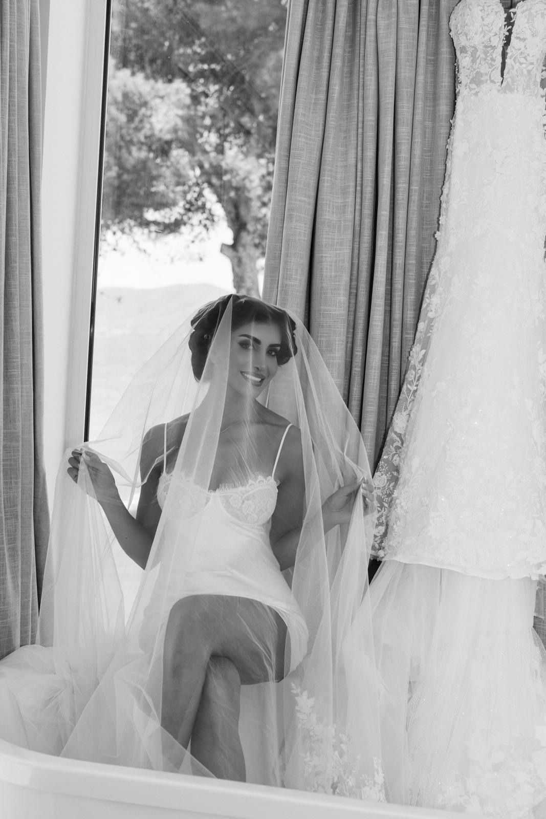 The bride getting ready in a luxury suite at ME Ibiza, featuring professional styling and a modern bridal look