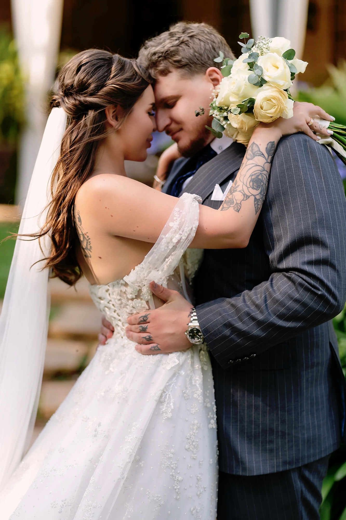 Intimate close-up of the bride and groom face-to-face, showcasing flawless bridal makeup and polished hair styling for a Valencia wedding.