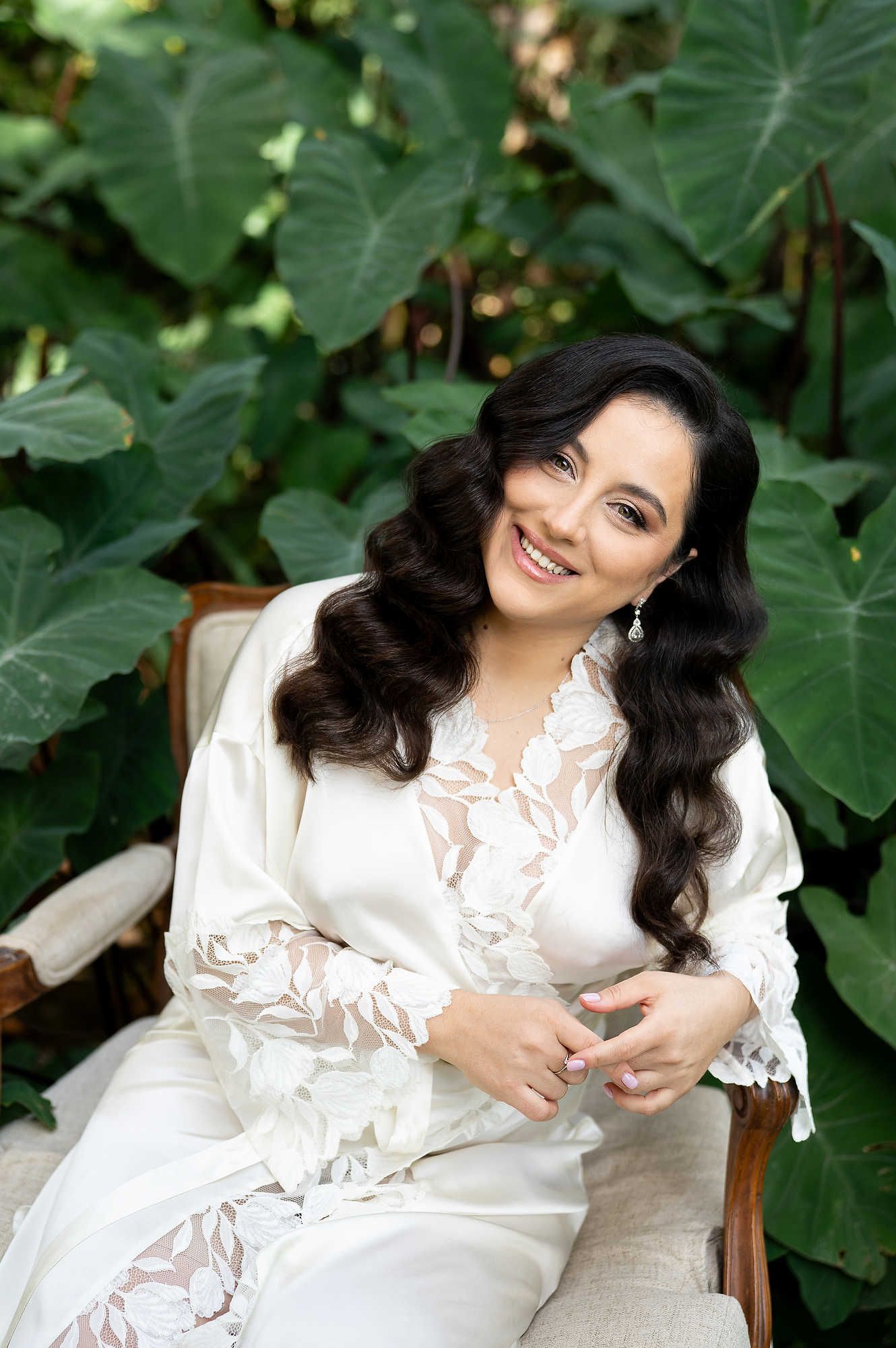 Close-up bridal beauty portrait featuring professional Hollywood waves and elegant wedding makeup styling