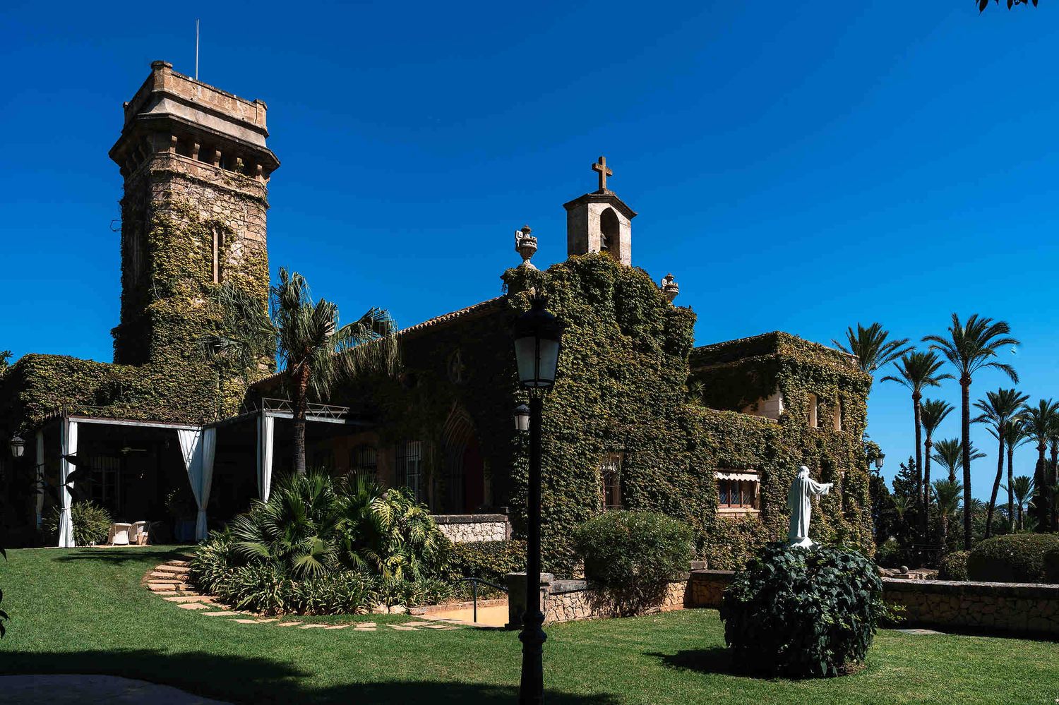 A grand wide-angle shot of the historic Villa Casa Santonja architecture, a premiere luxury wedding destination in Spain