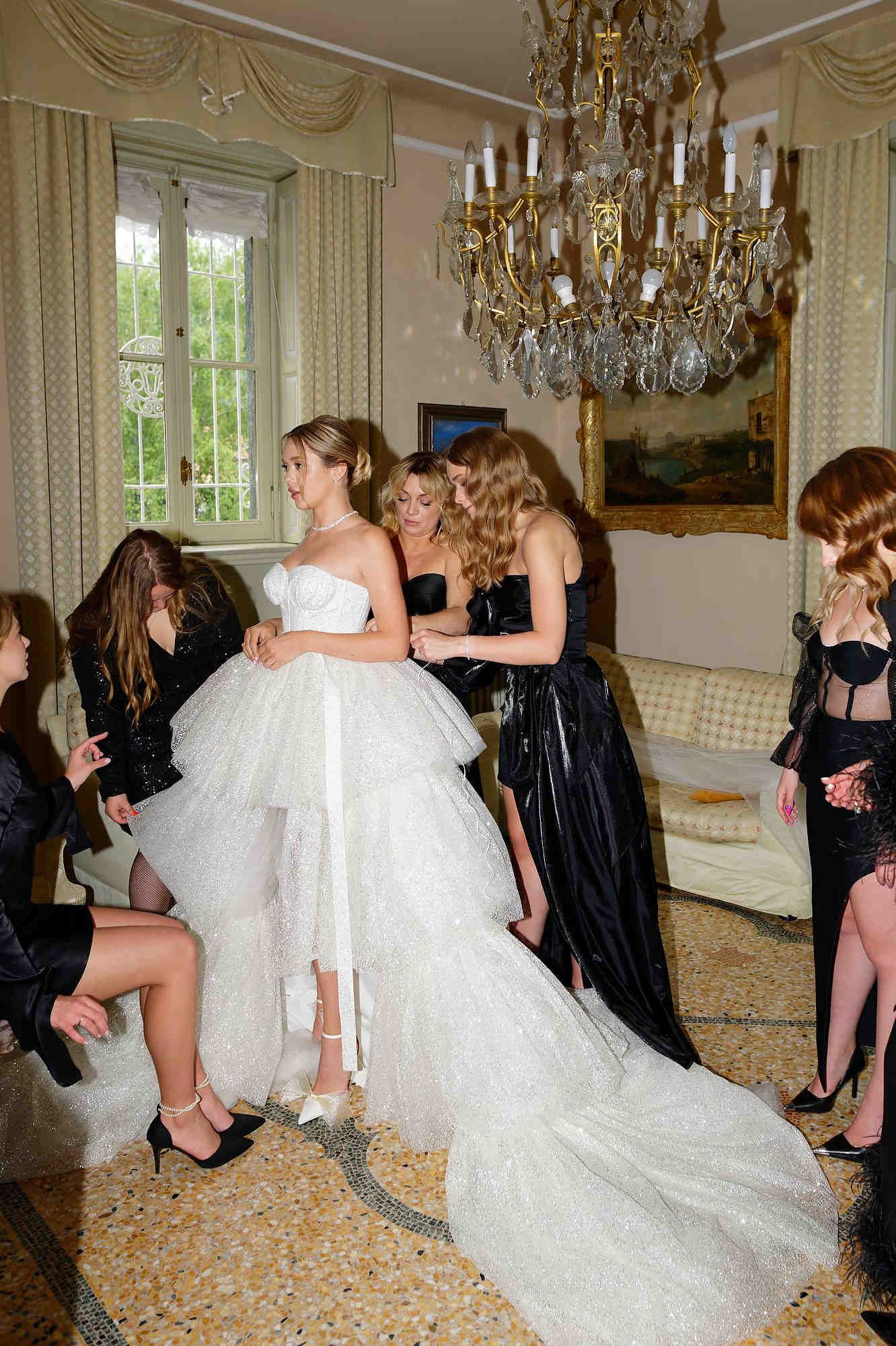 Sophisticated wedding hair styling for a bride, overlooking the mountains and water of Lake Como, Italy.