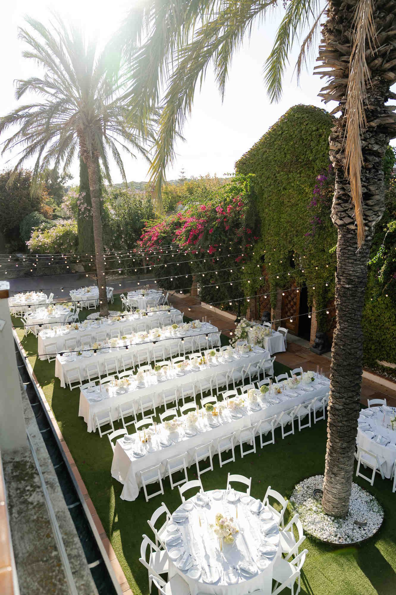 Wide shot of the expensive wedding banquet decor at Gran Villa Rosa, showing elegant table settings and floral design
