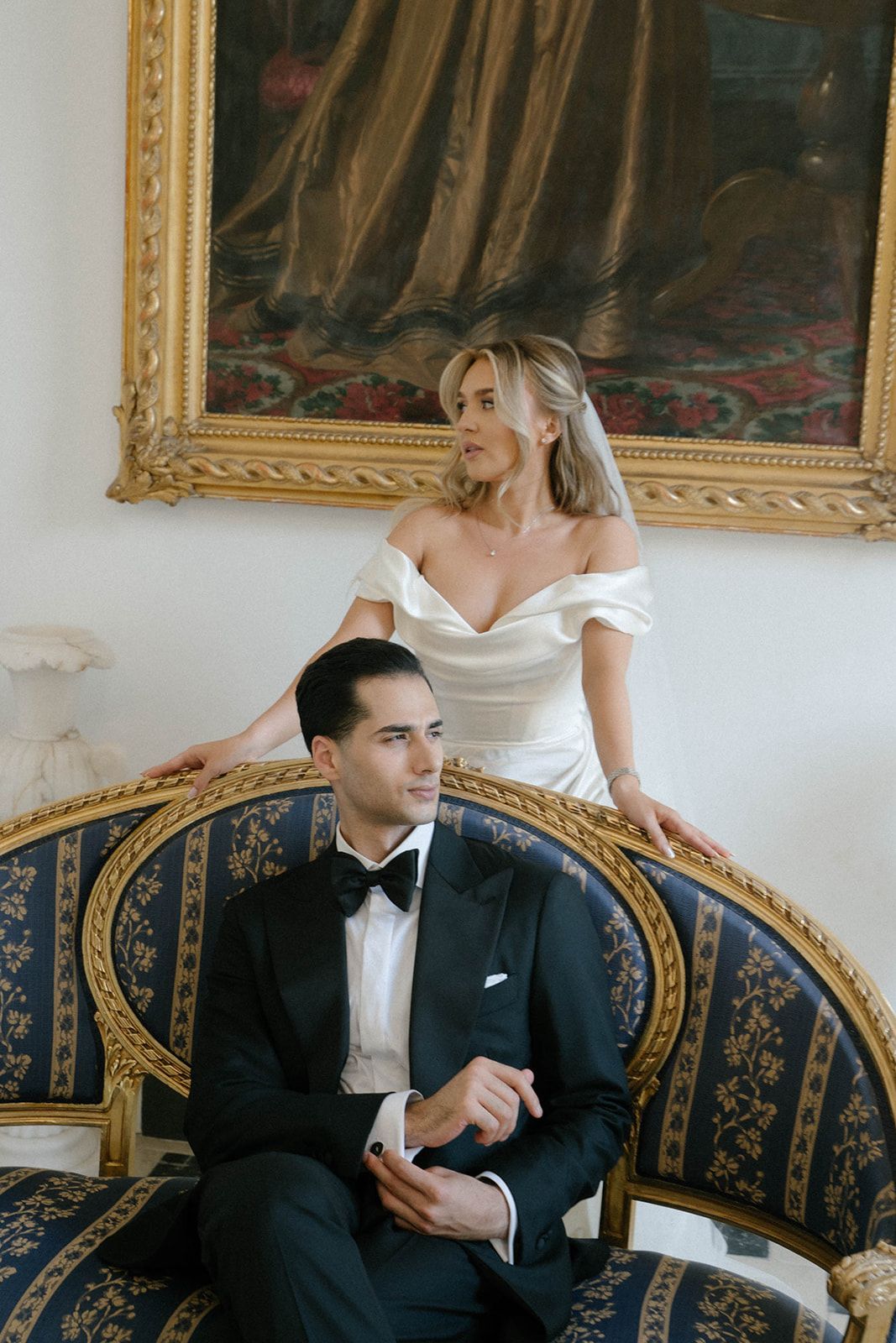 Luxury fashion wedding photoshoot of a groom and bride in the grand historic interior of Finca Marqués de Montemolar in Altea, Spain.