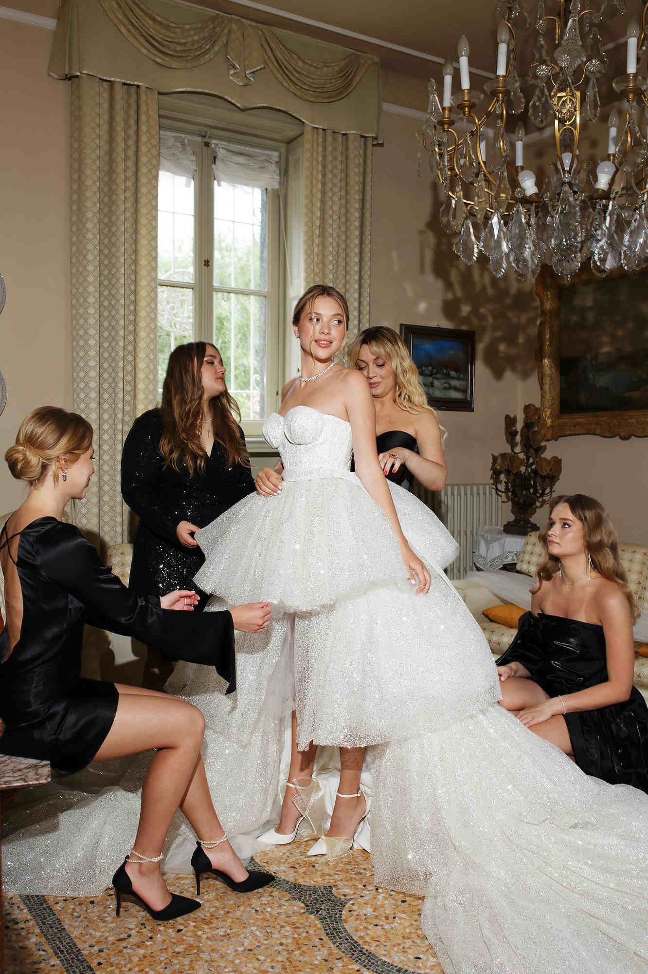Happy bride and bridesmaids during the morning preparation at a luxury villa on the shores of Lake Como Italy.