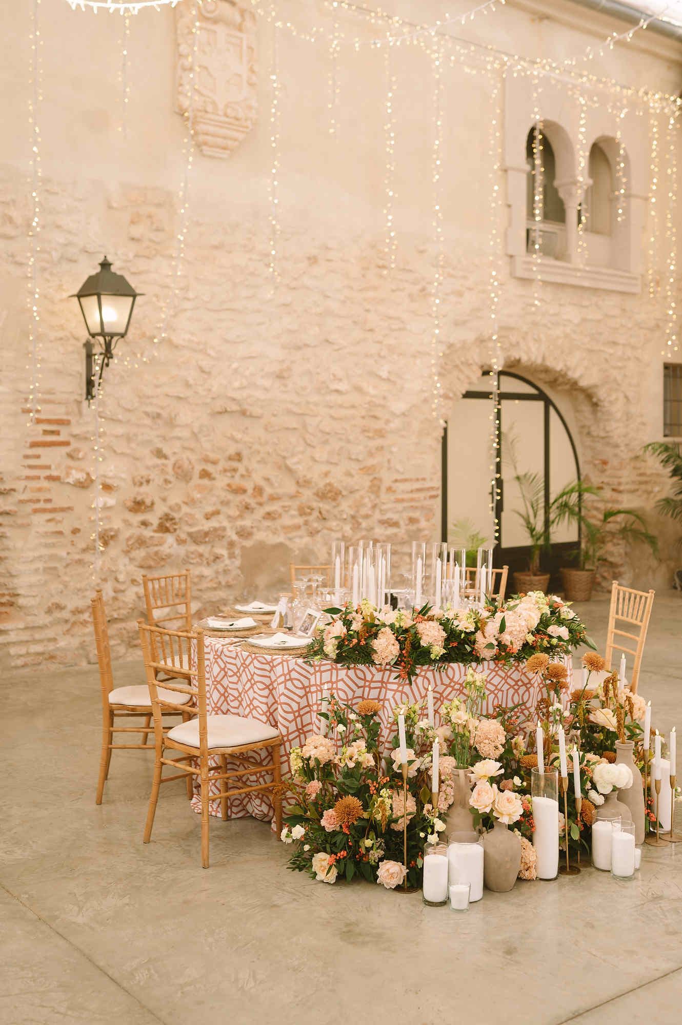 Elegant wedding banquet hall decoration at Mas d’Alzedo, showcasing a blend of rustic and modern styles