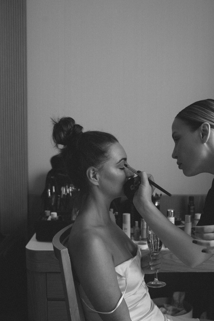 Professional makeup artist Anastasia Larionova applying bridal makeup for a luxury wedding at Las Arenas Balneario Resort in Valencia.