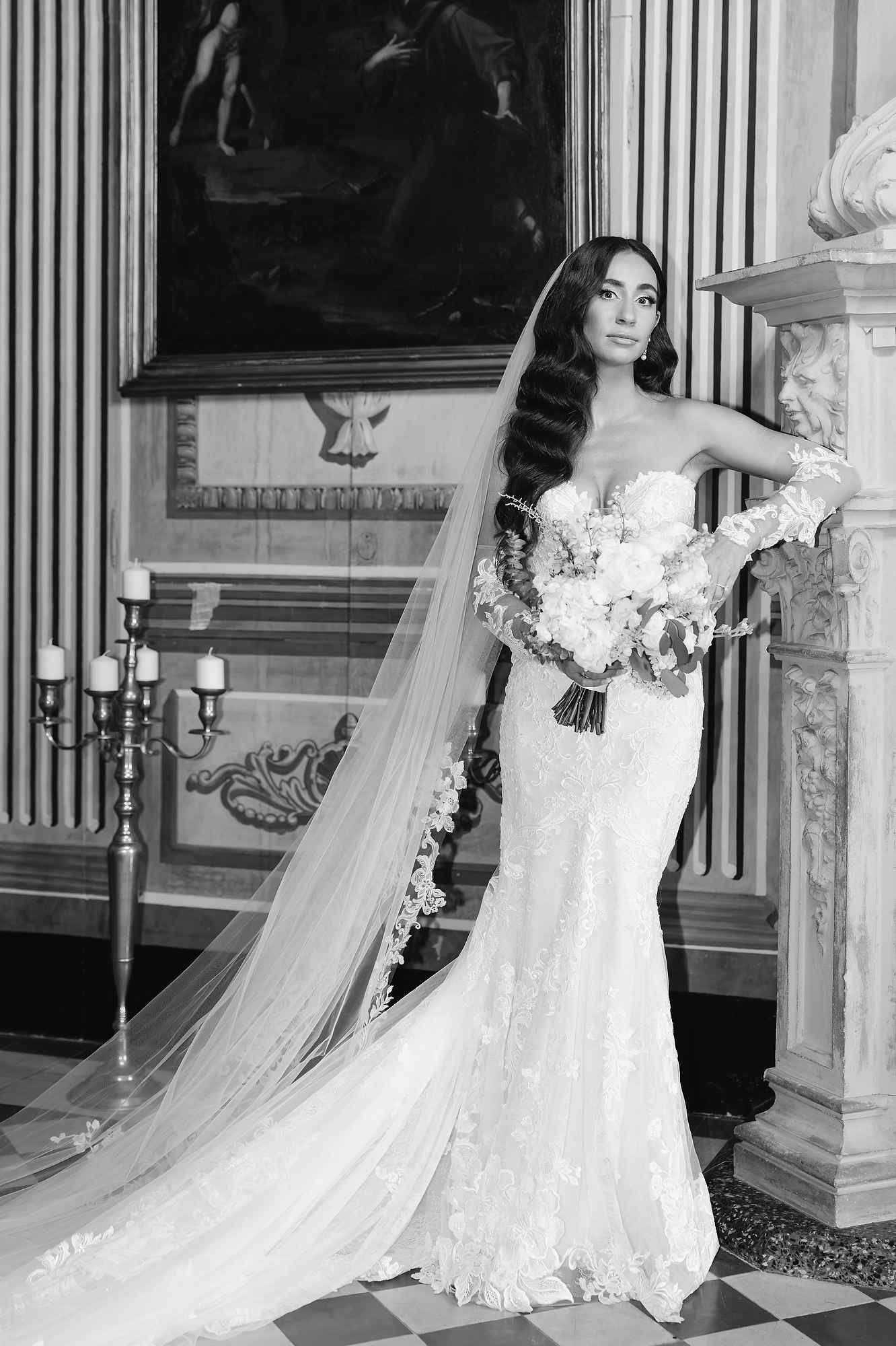 A high-end bridal portrait featuring polished styling that complements the noble stone architecture of the Barcelona estate