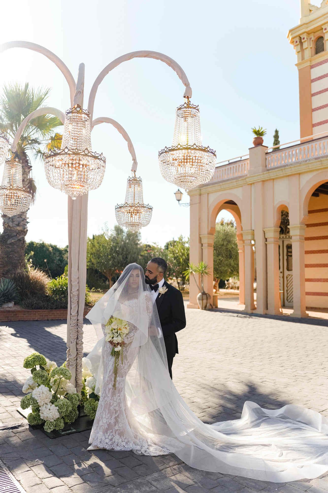 Romantic portrait of the couple under the veil at Gran Villa Rosa, showing the full bridal dress and elegant styling.