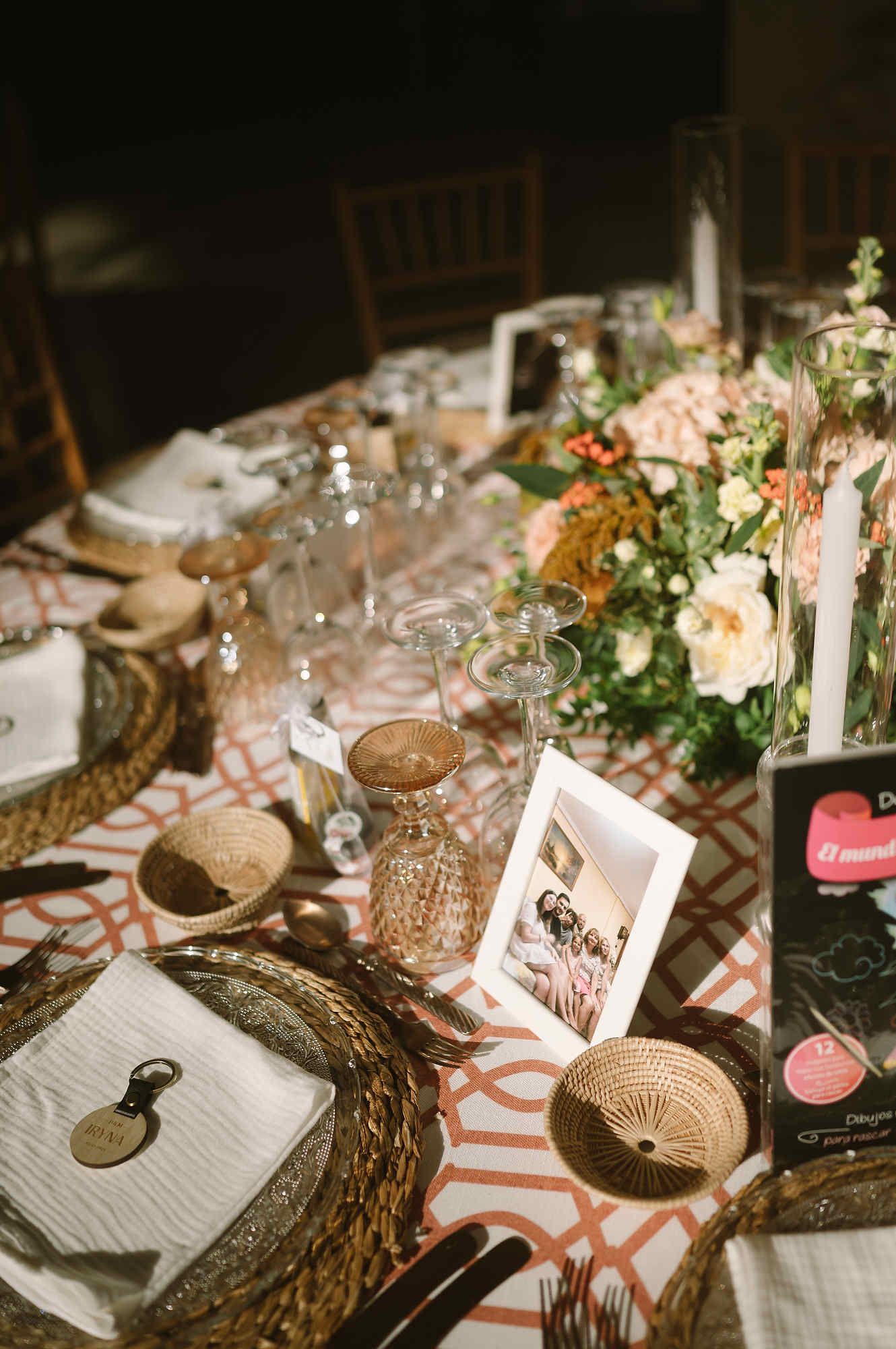 Sophisticated wedding table setting and floral centerpieces for a reception at Mas d’Alzedo.