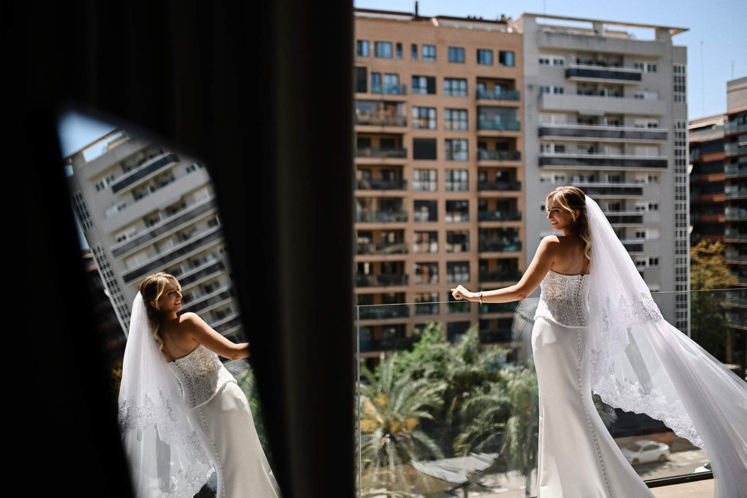 Bridal prep photoshoot at Villa Delia Valencia; bride posing in green palm gardens directly after hair and makeup styling.