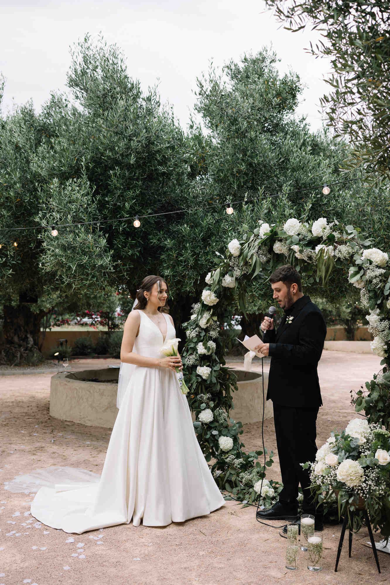 Groom reciting his wedding vows during the outdoor ceremony at the Alqueria del Xúquer villa in the Valencian countryside.