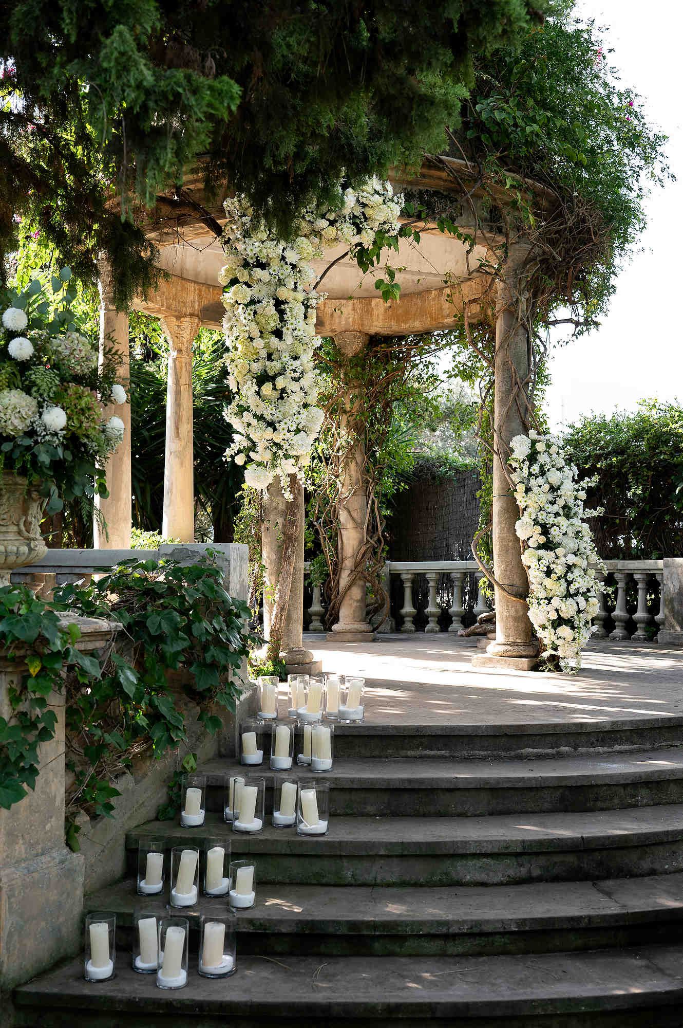 Elegant outdoor wedding ceremony location at Casa Santonja with luxury floral decor and Mediterranean architecture