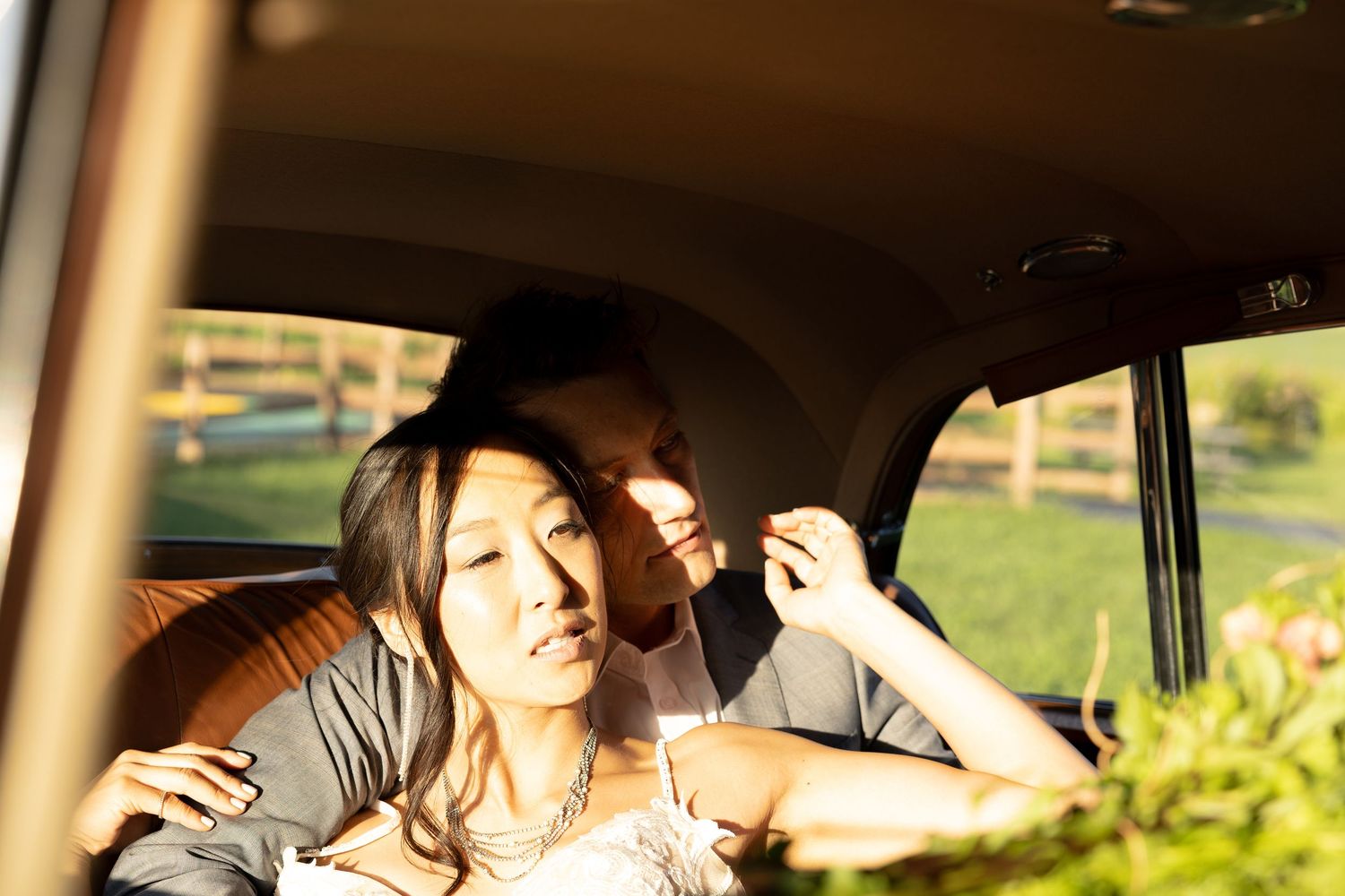 Golden hour photography inside vehicle with natural sunlight streaming through windows.