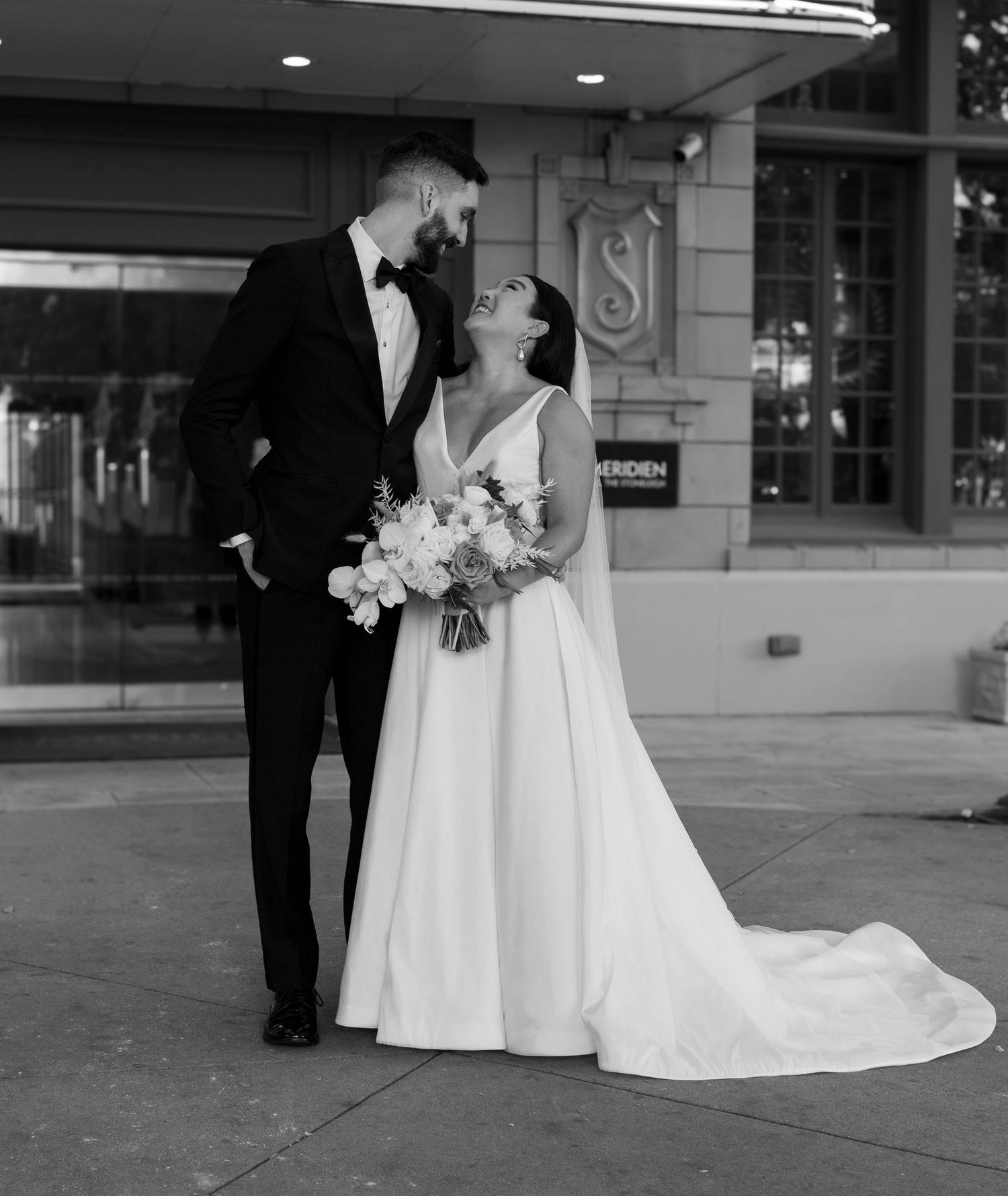 Black and white wedding portrait captured outside Le Meridien hotel.
