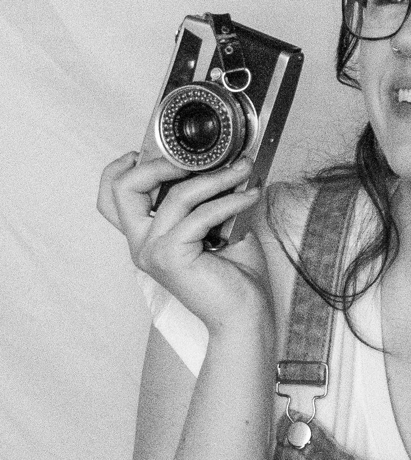 Hands holding vintage cameras against a white background in a sequence of artistic shots.