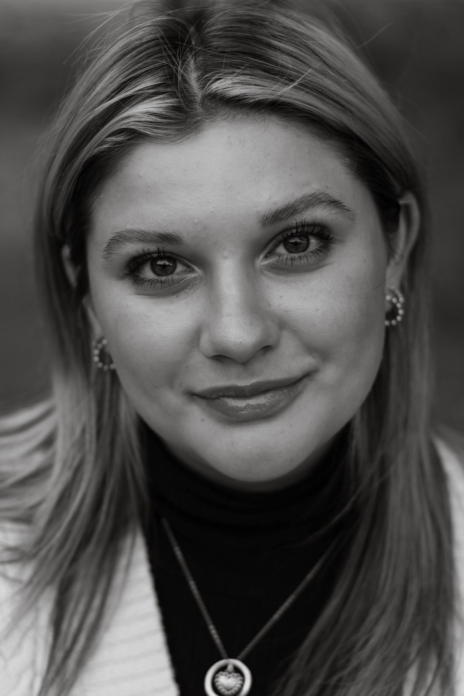Black and white close-up portrait with expressive lighting.