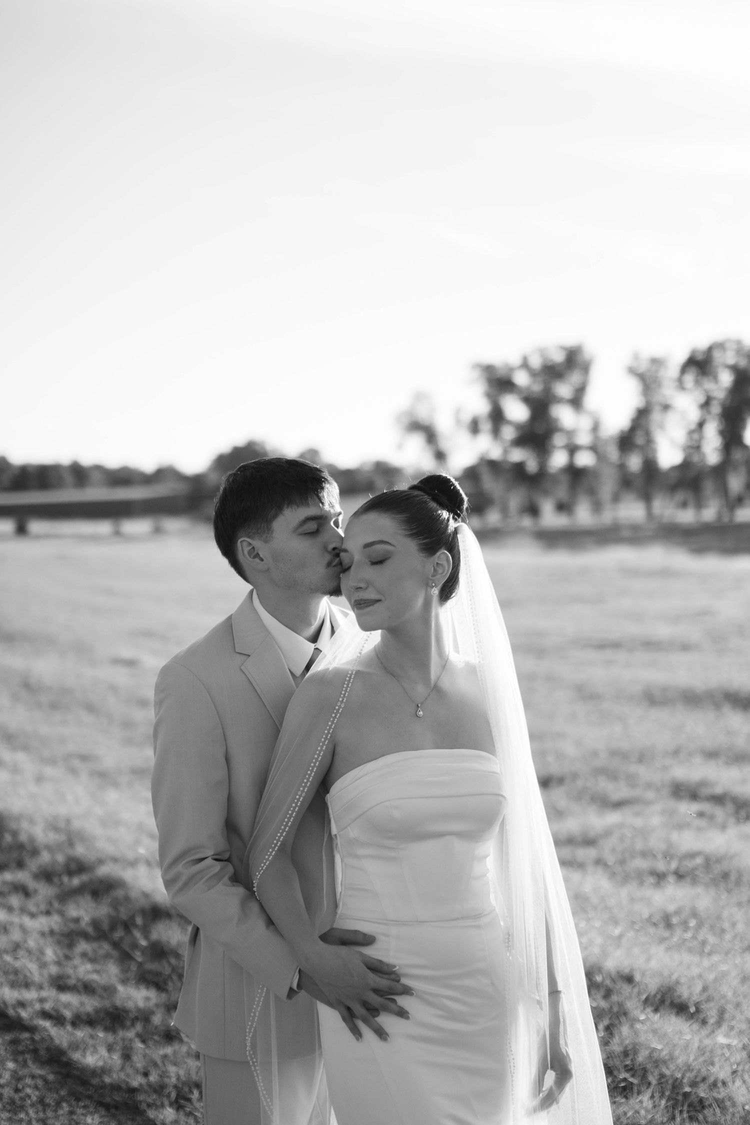 A series of intimate wedding portraits showing tender moments between a couple in a natural outdoor setting.
