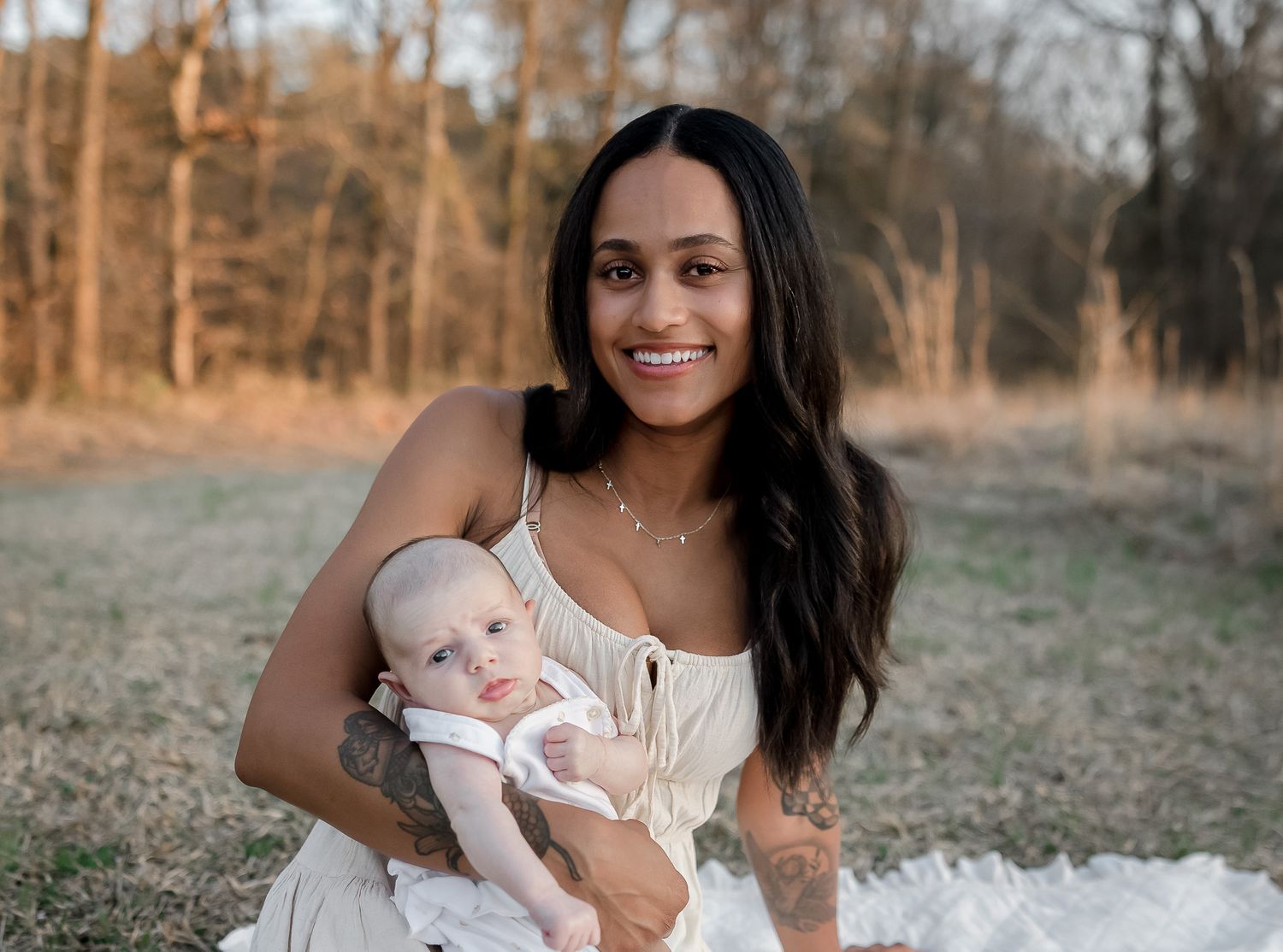 A series of outdoor family portraits in a field at sunset showing tender moments between parent and child.