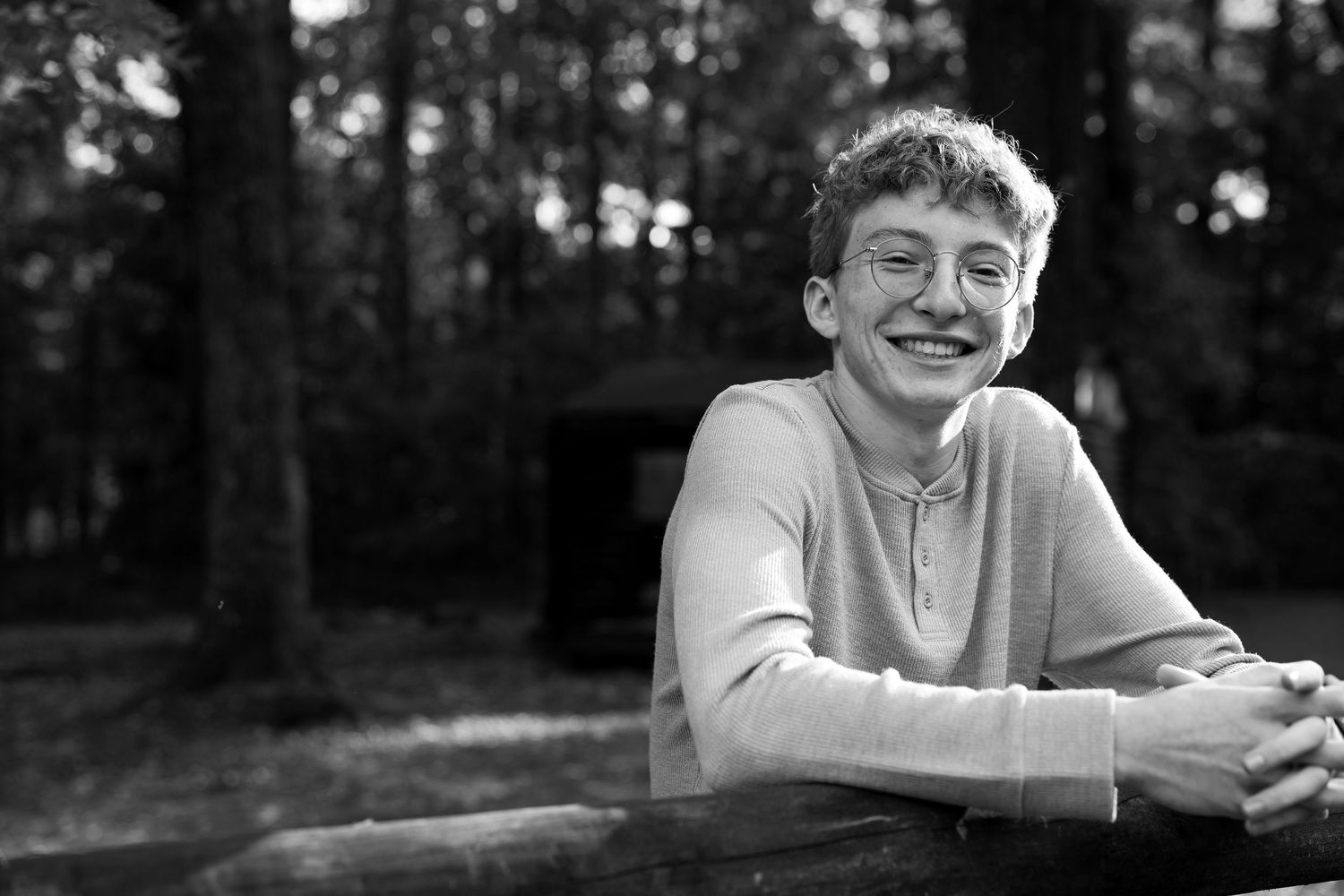 Black and white portrait series showing joyful expressions.
