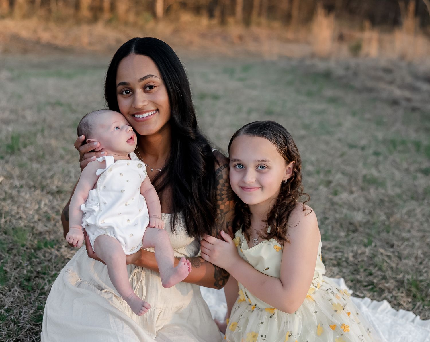 A series of outdoor family portrait photographs showing tender moments between loved ones at sunset in a grassy field.