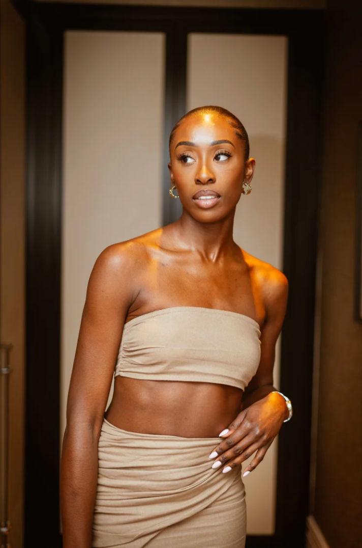 Woman in beige strapless top poses expressively in a series of artistic portraits.
