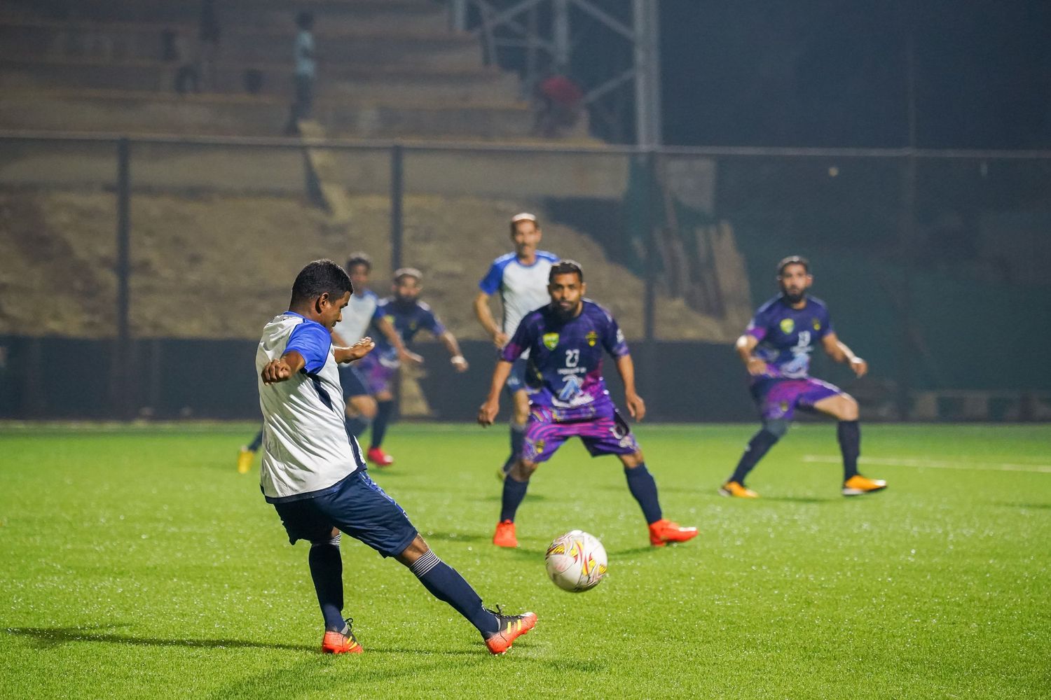 player kicking a football