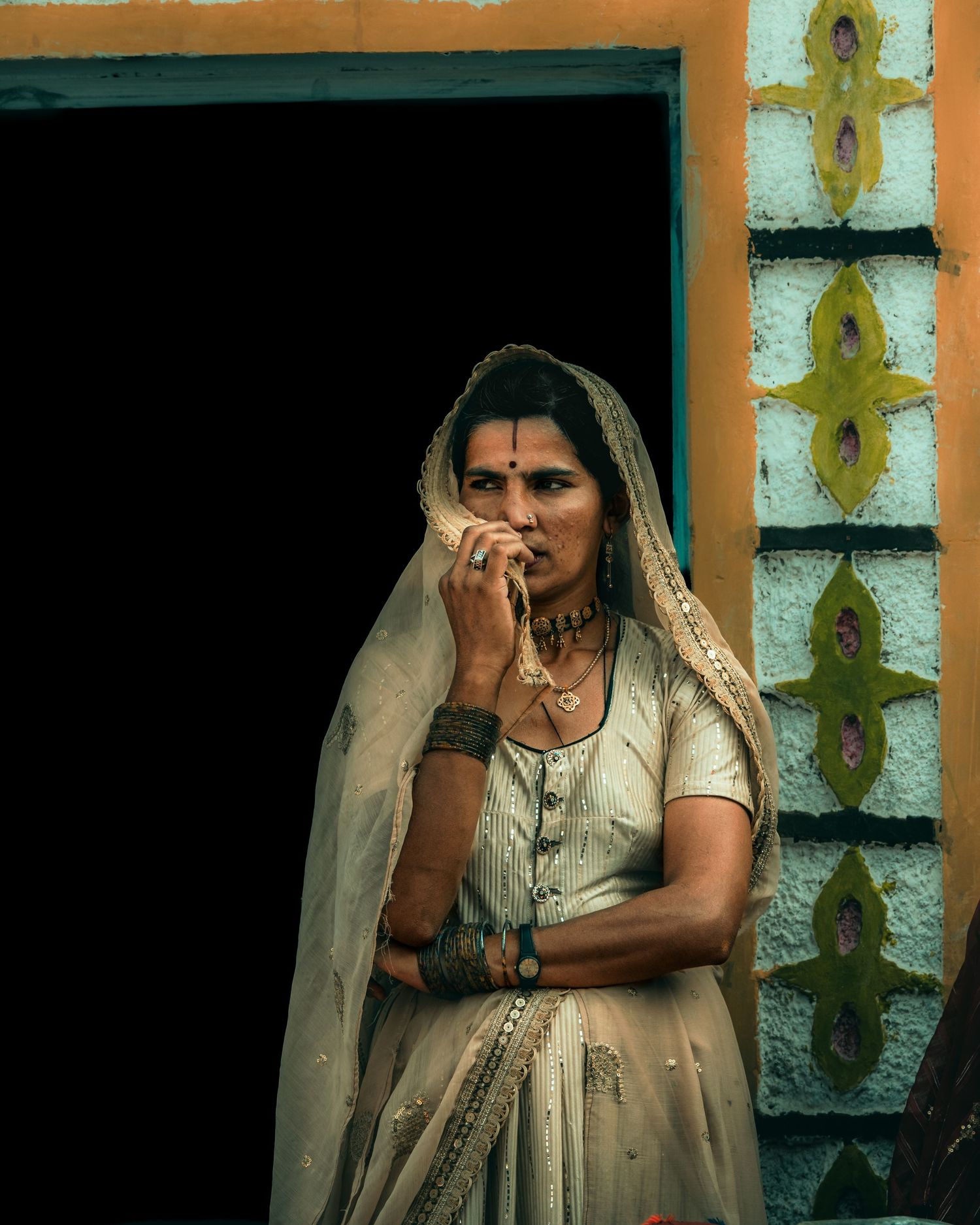 A women covering her face.