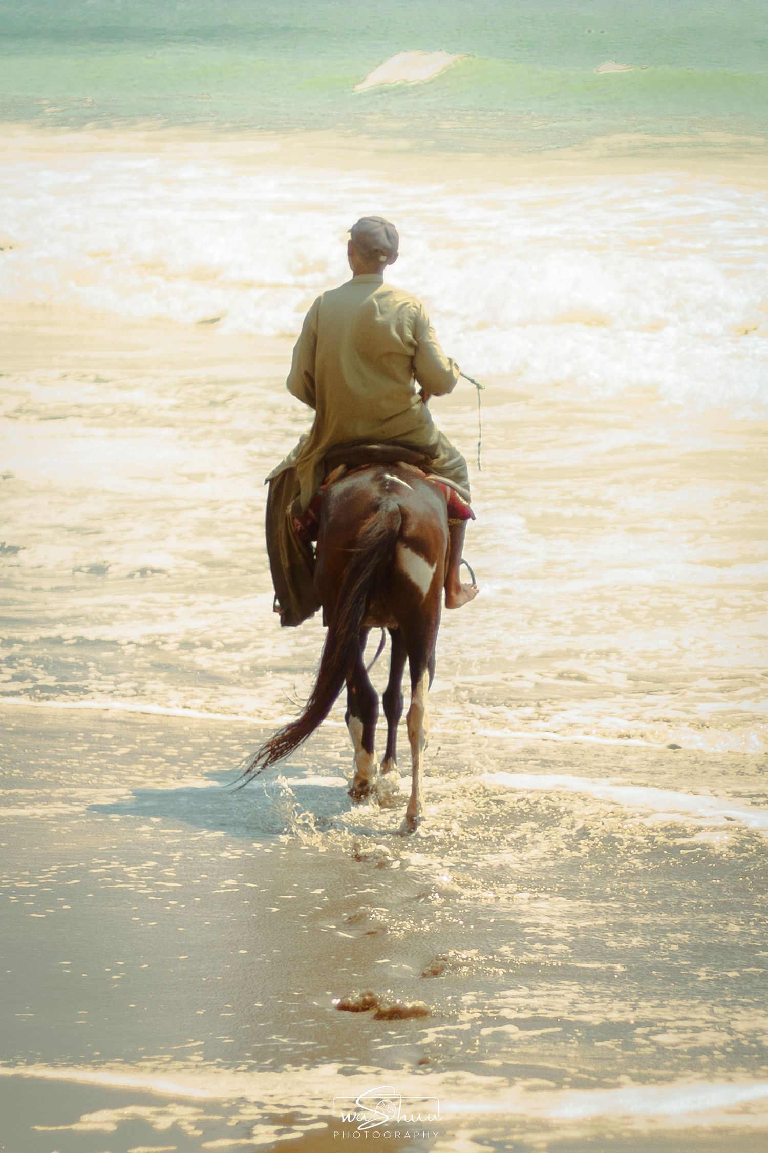 Dreamy shot of man riding a horse.
