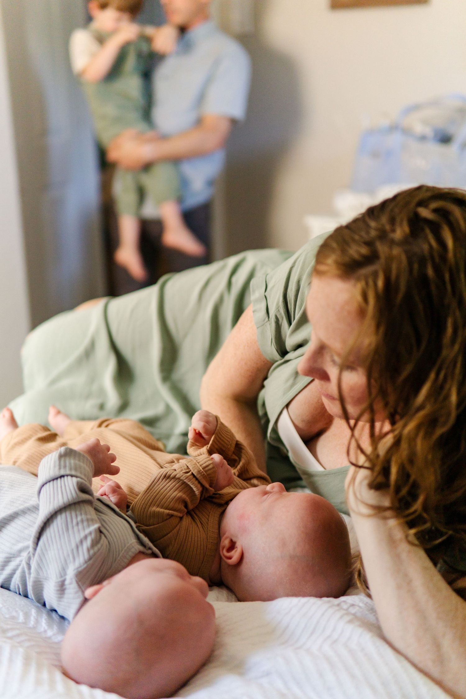 Gentle family moments captured in sequence on bed.