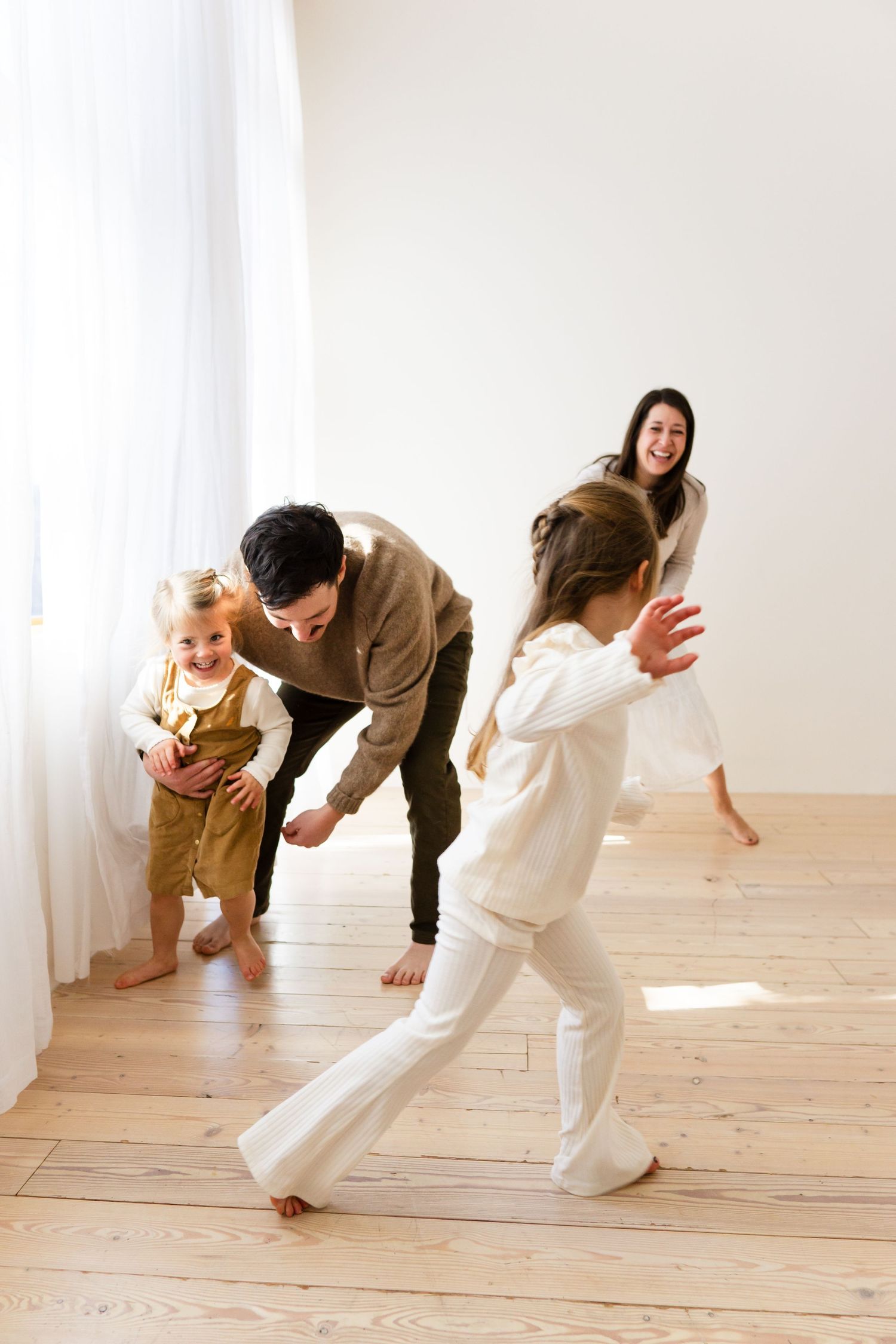 Family playing during a studio family photography session in Denver Colorado