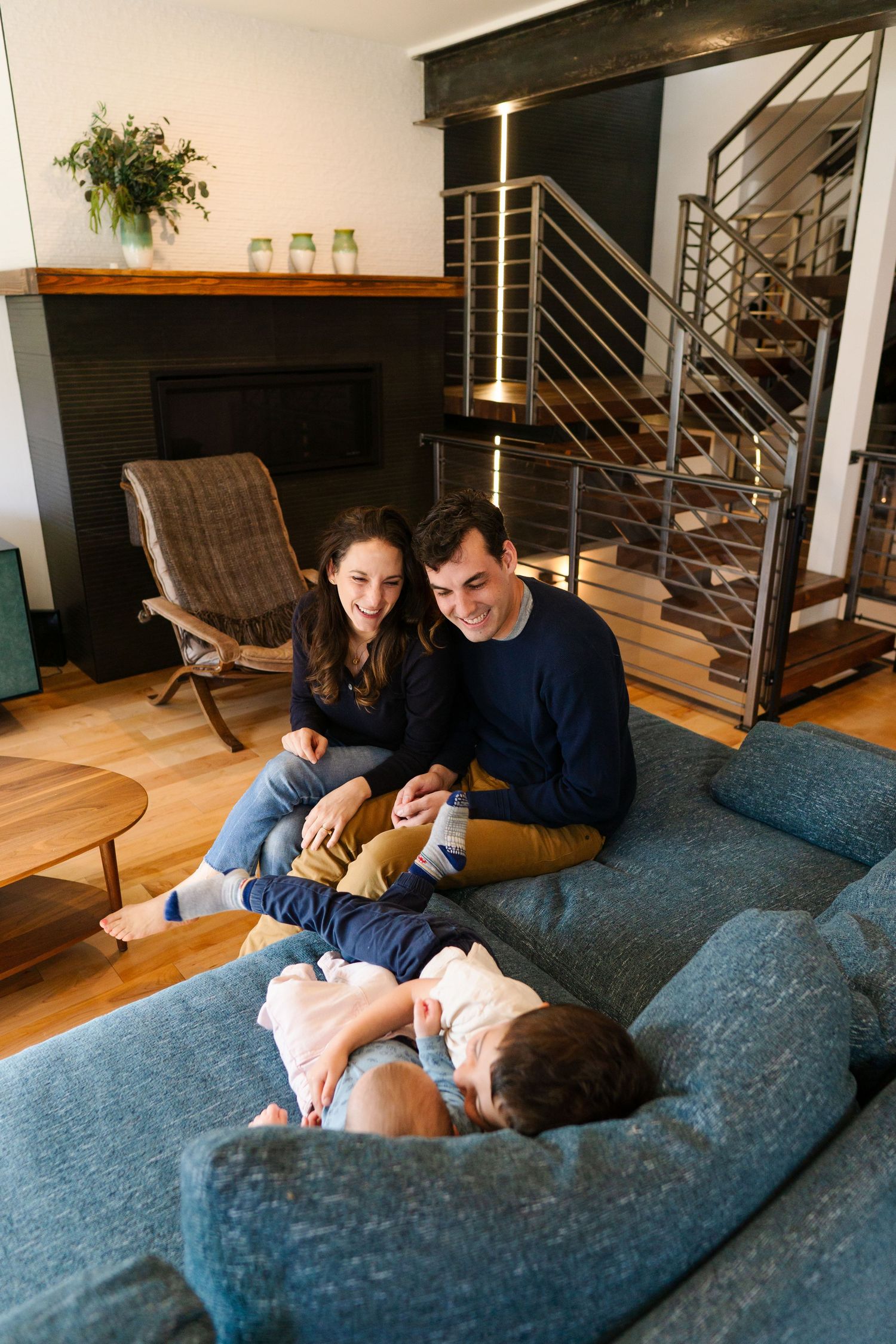 Family playing and relaxing during in-home family mini session in Denver Colorado