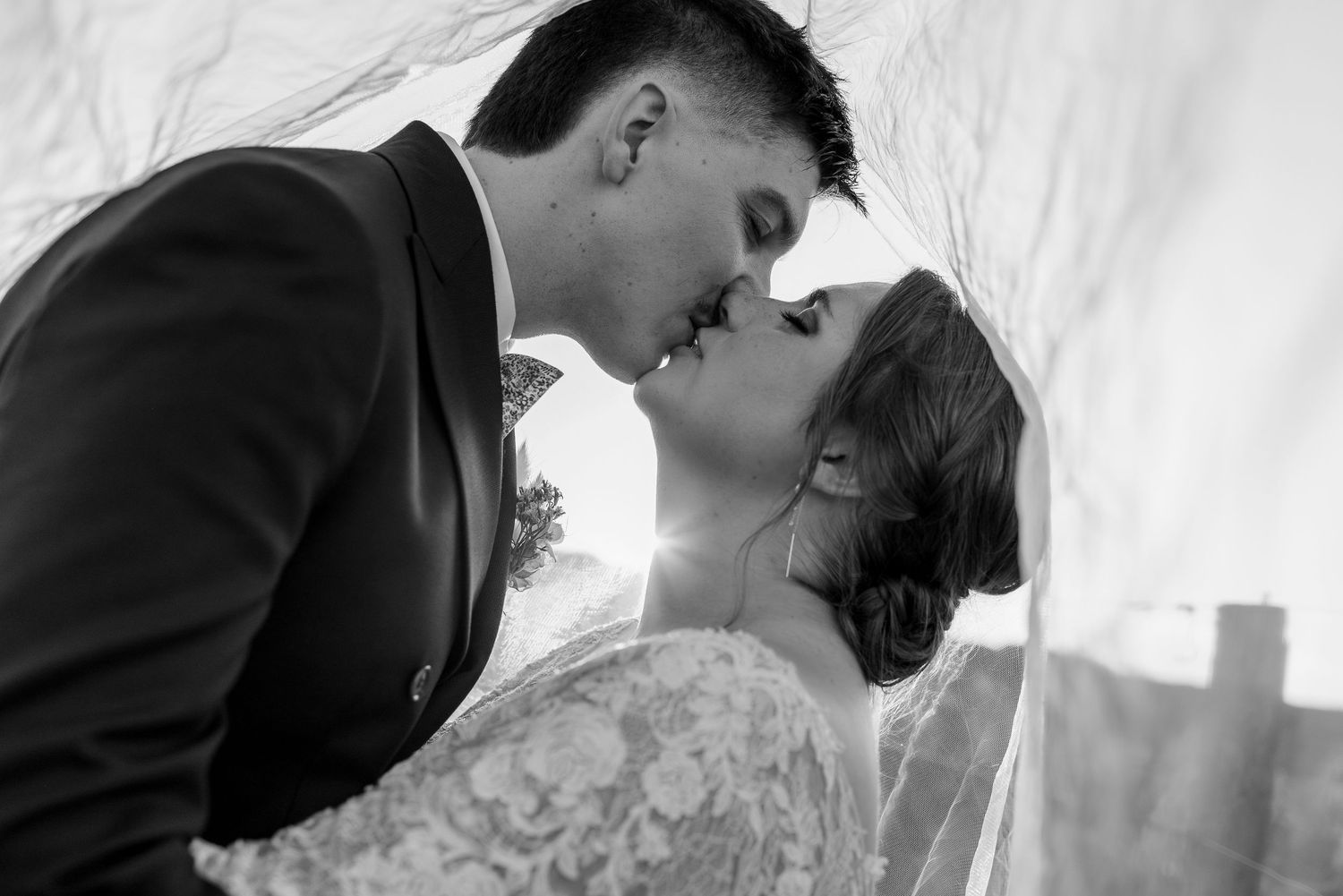 Close-up black and white photos of tender romantic moments.
