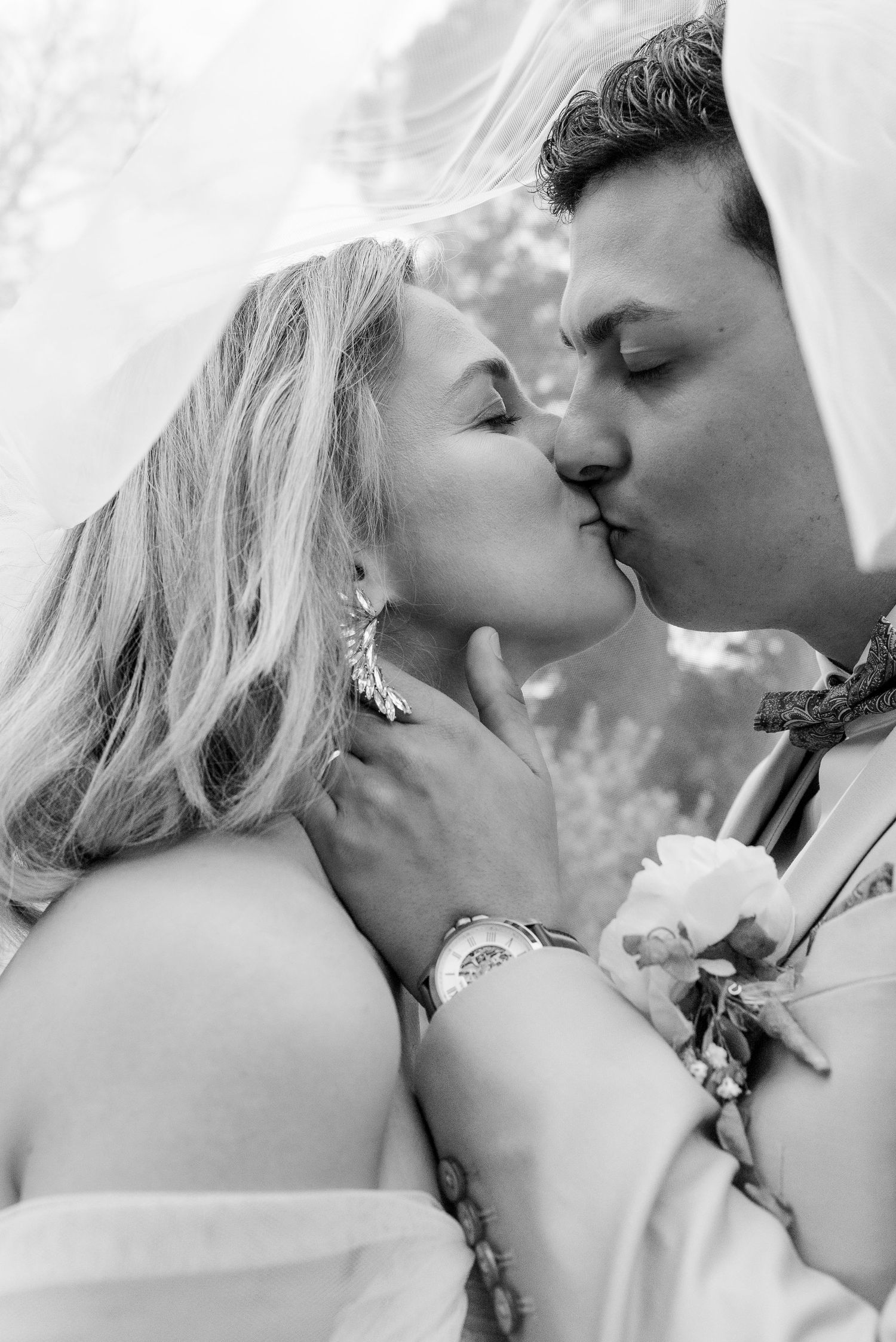 Black and white wedding photos capturing intimate romantic moments between a couple.