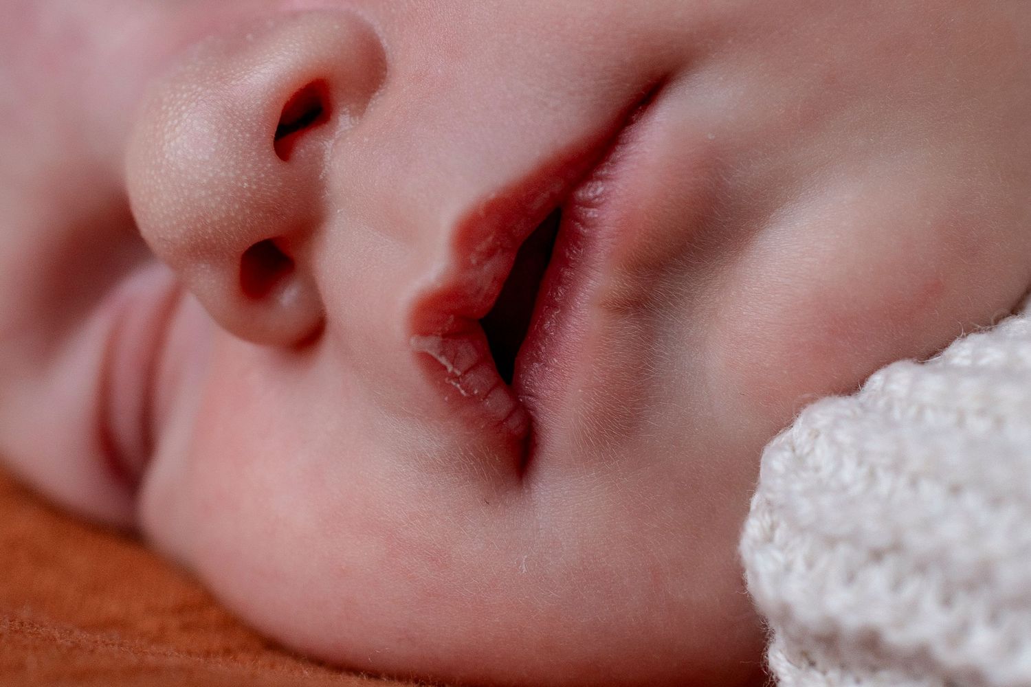 Intimate close-up photos showing delicate details of a sleeping baby.