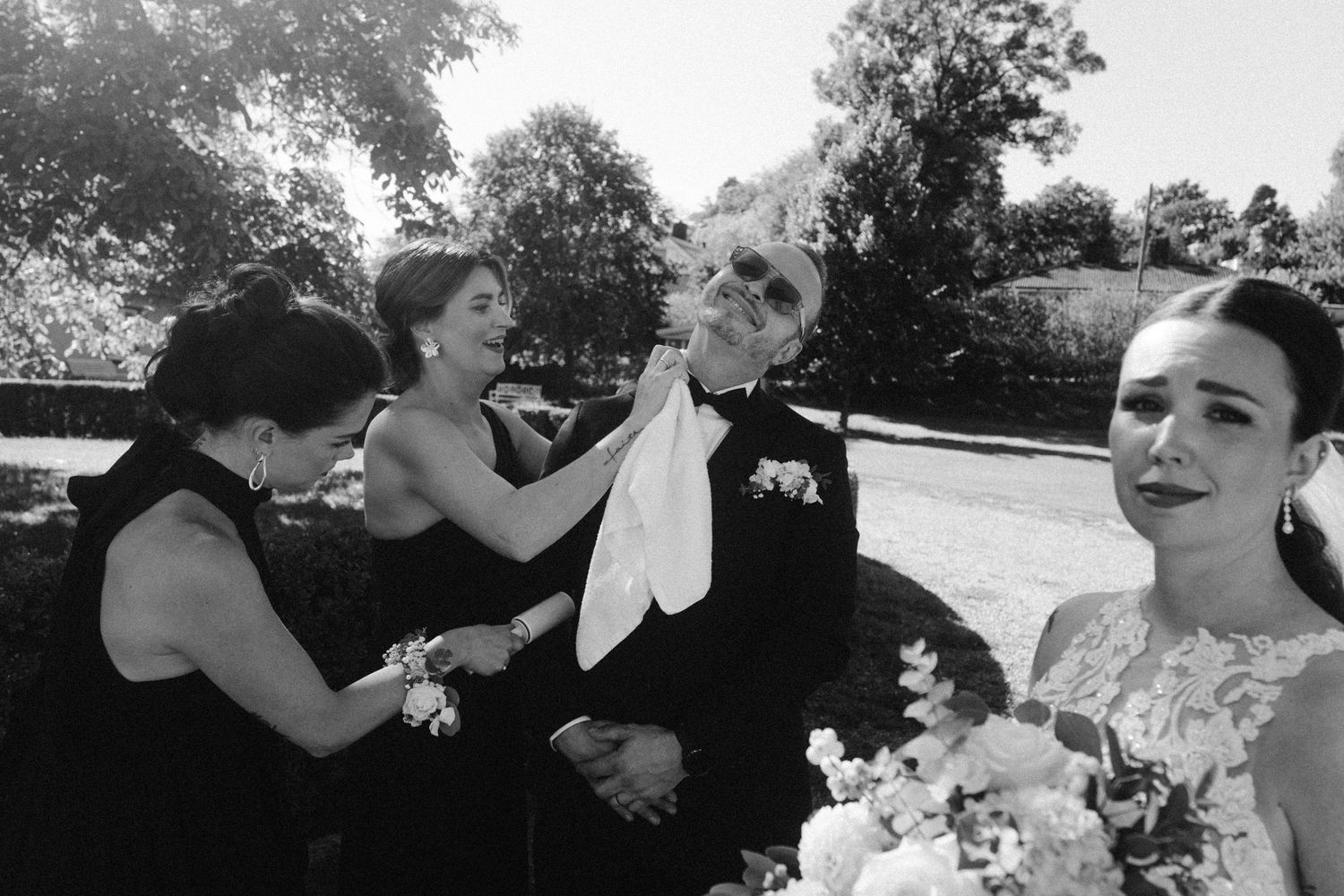 A black and white photo montage showing candid romantic moments between a couple outdoors in nature.