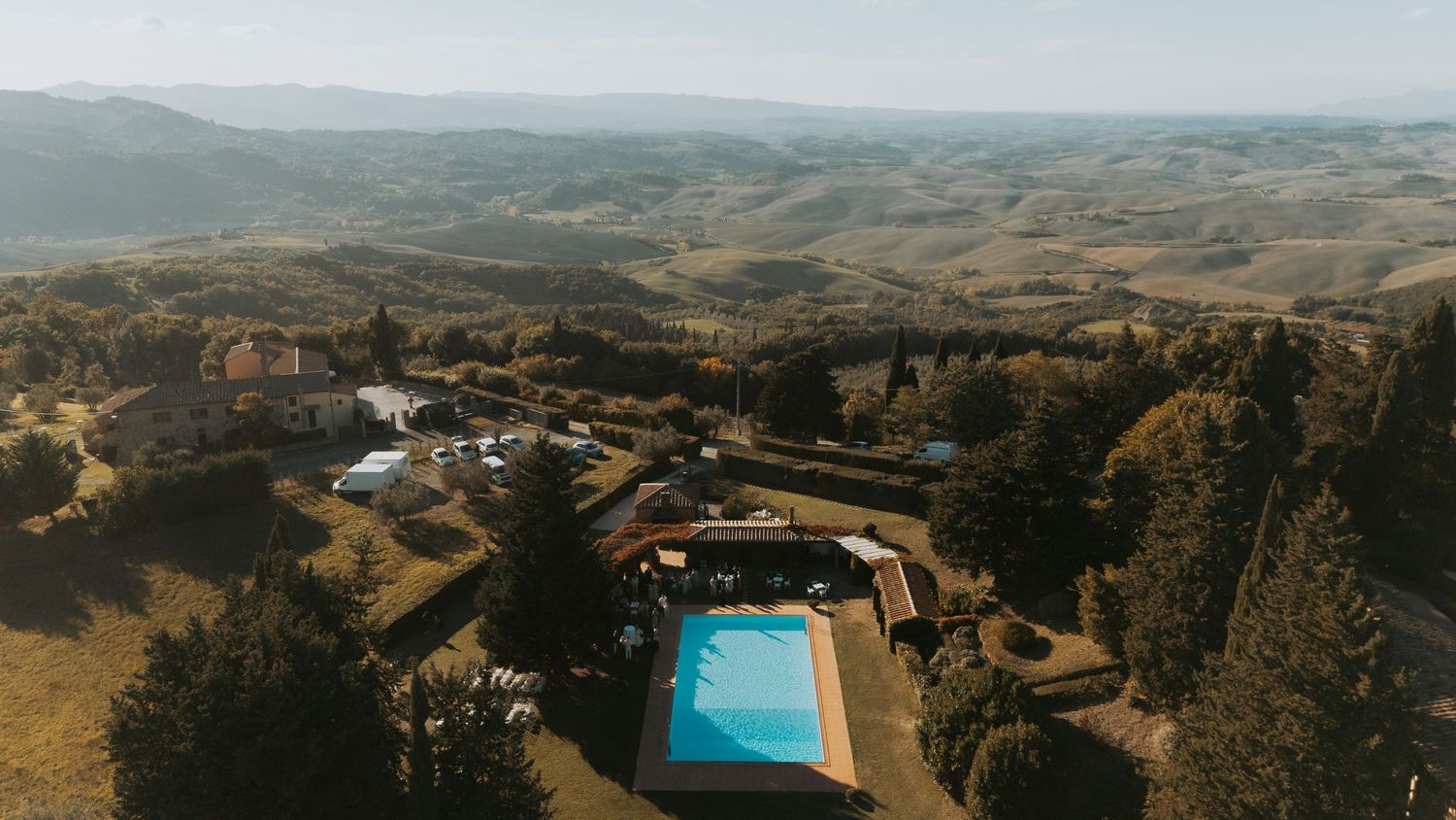 Sweeping panoramic view of rolling hills and countryside from a mountaintop wedding venue.