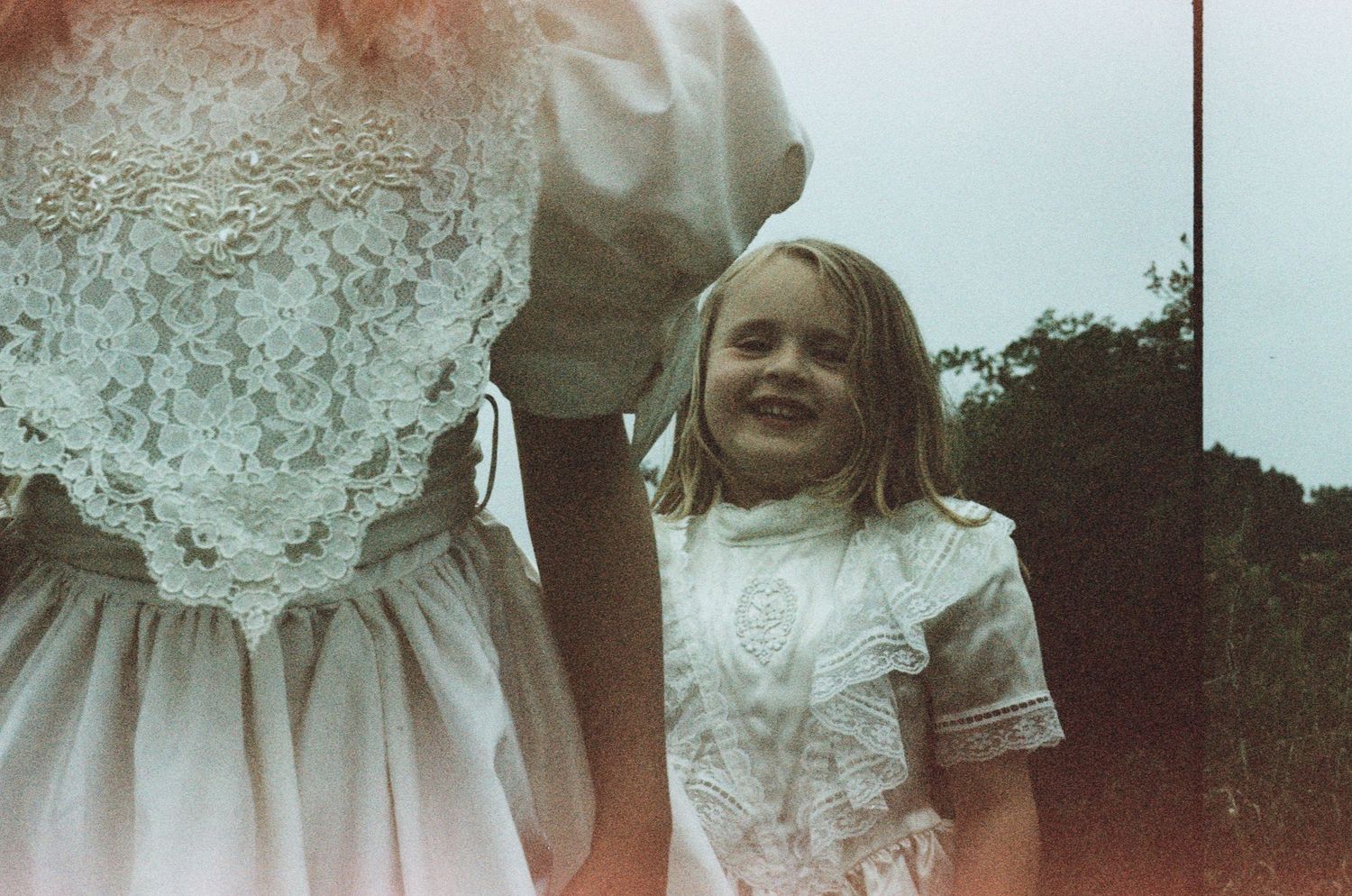 vintage-style photographs showing joyful moments outdoors with ethereal light and natural settings. vintage film, north shore massachusetts