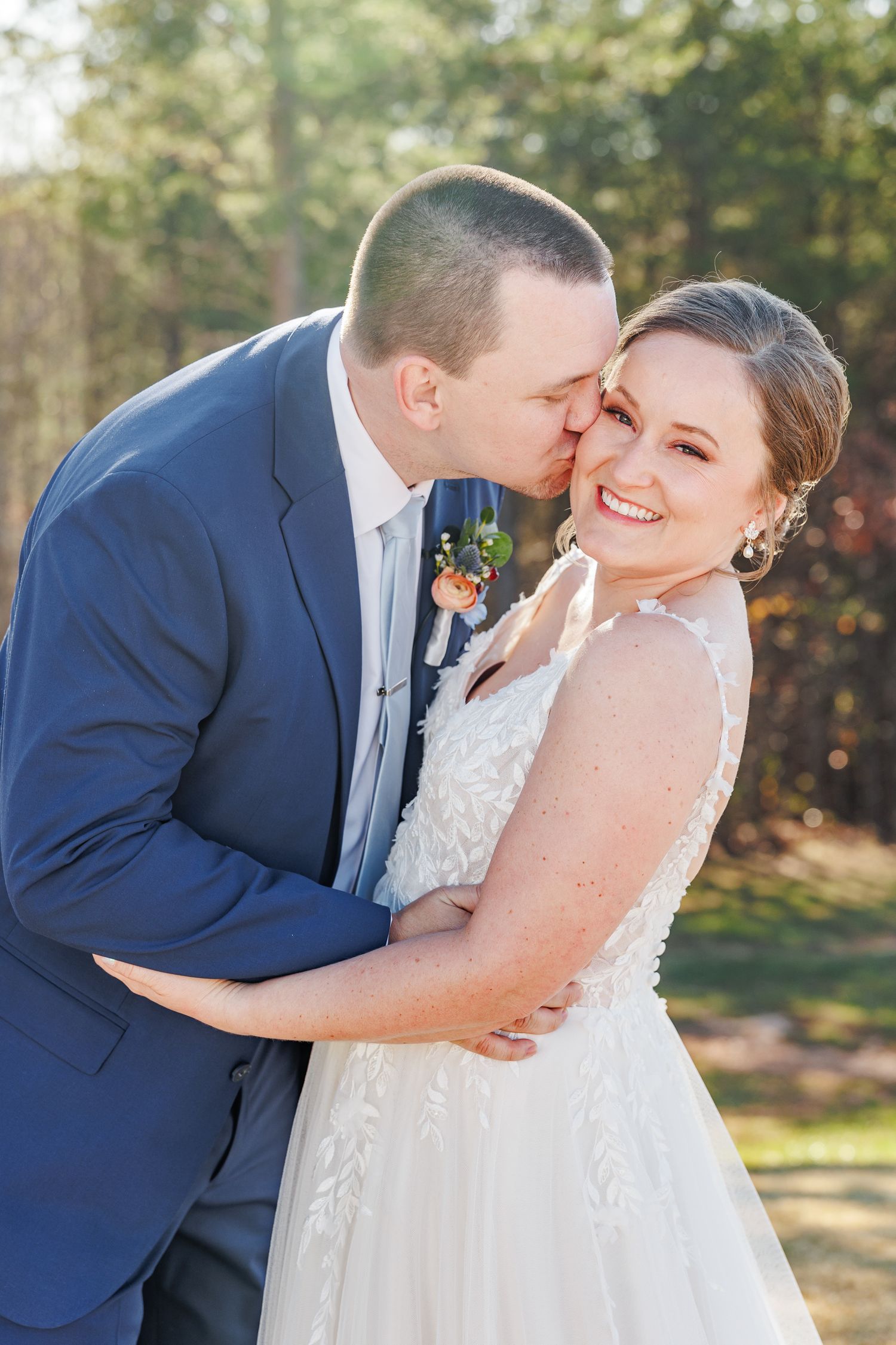 Romantic wedding moment captured in outdoor autumn setting at Serre Vineyards with NC wedding photographer
