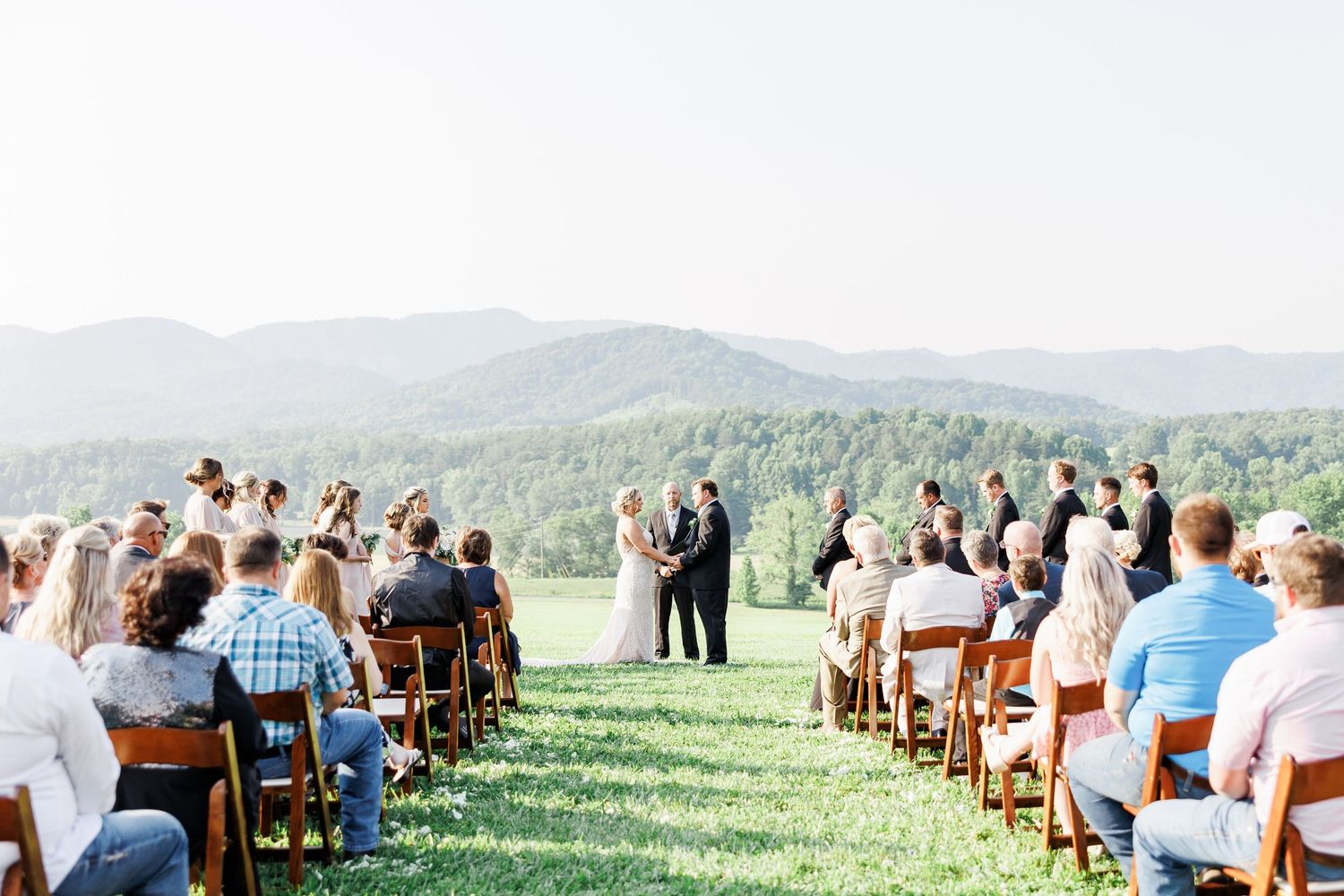 Outdoor wedding ceremony setup with wooden chairs facing mountain views at the Shilo with NC Wedding photographer