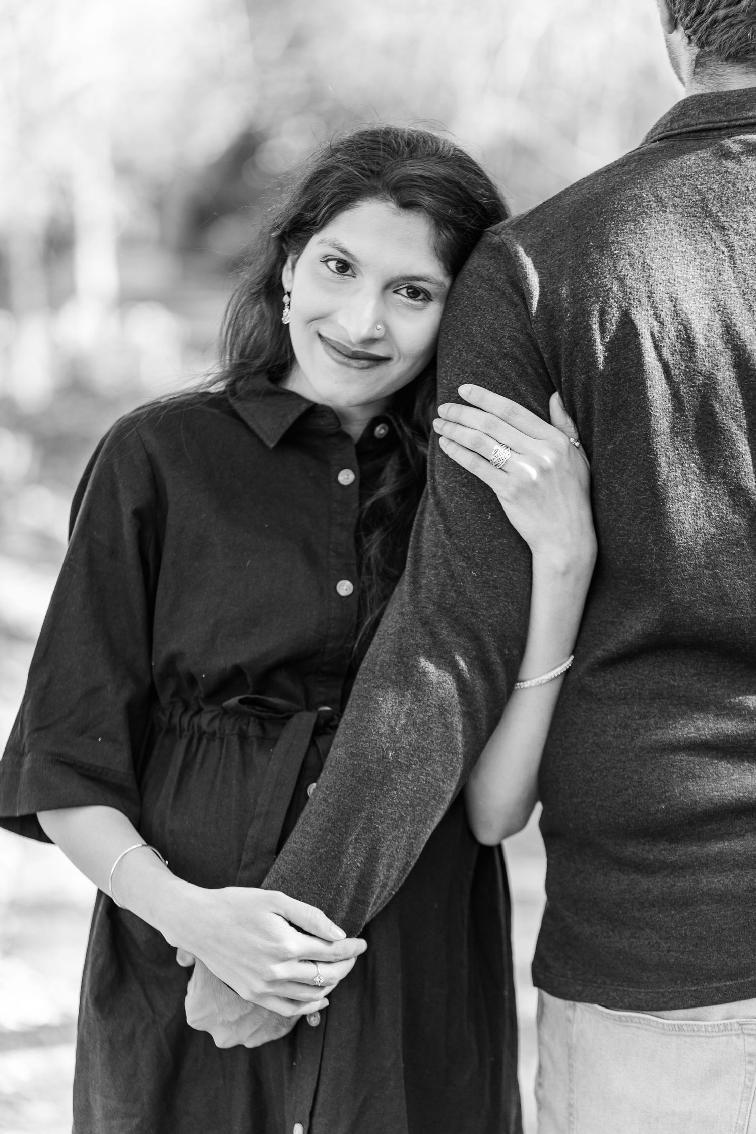 Intimate black and white maternity photo session showing couple embracing in Winston Salem  NC  with a Maternity Photographer