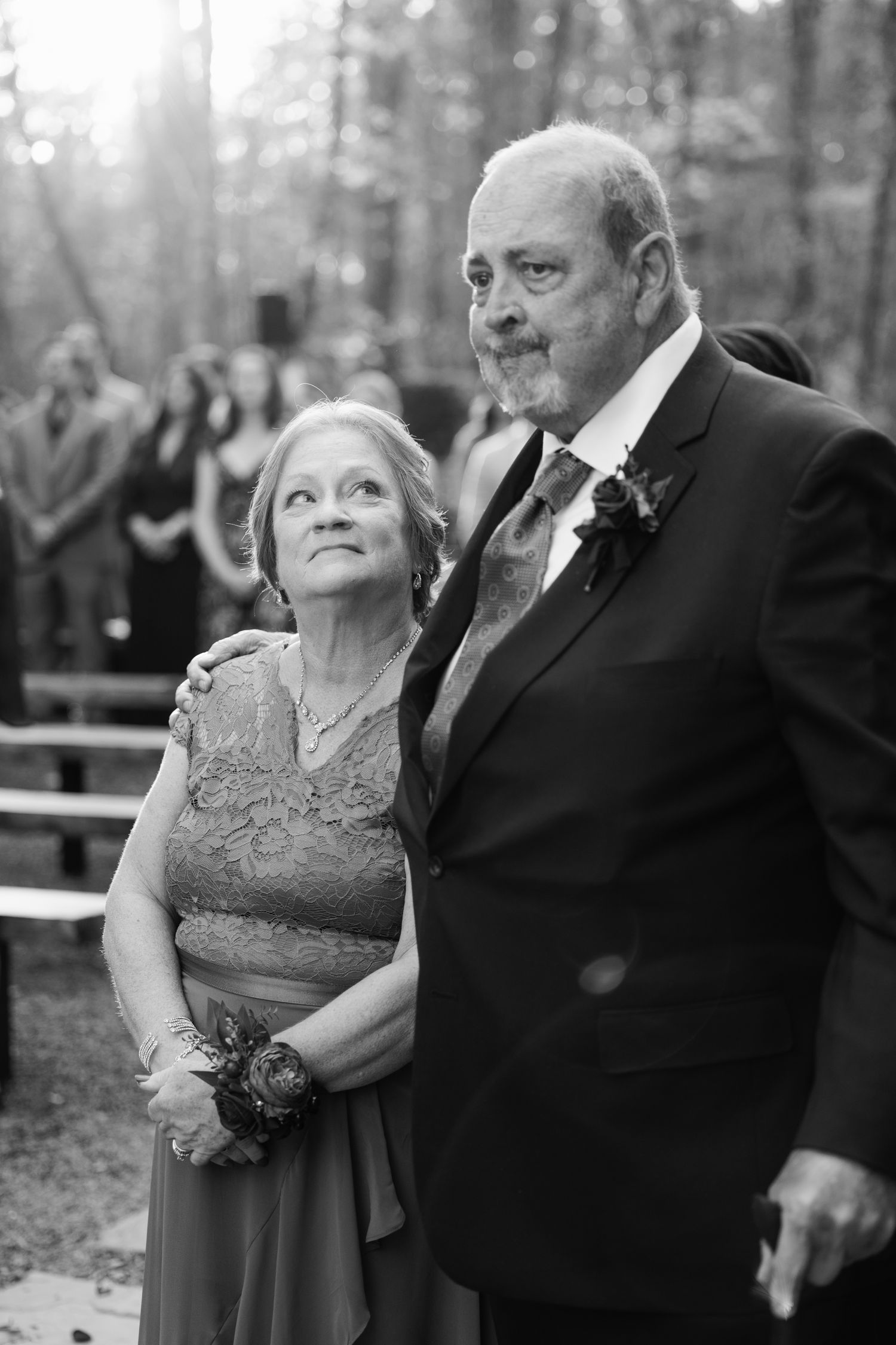 A couple shares a tender moment during their formal portrait session outdoors at the Barn at Union Grove Farm in Chapel Hill