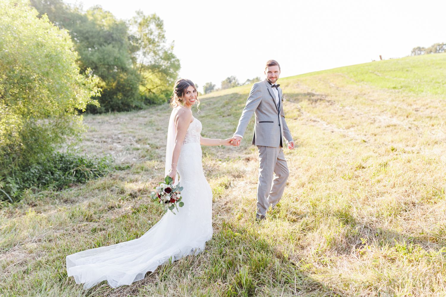 Romantic wedding photography session on a golden hillside during sunset  with NC Wedding Photographer