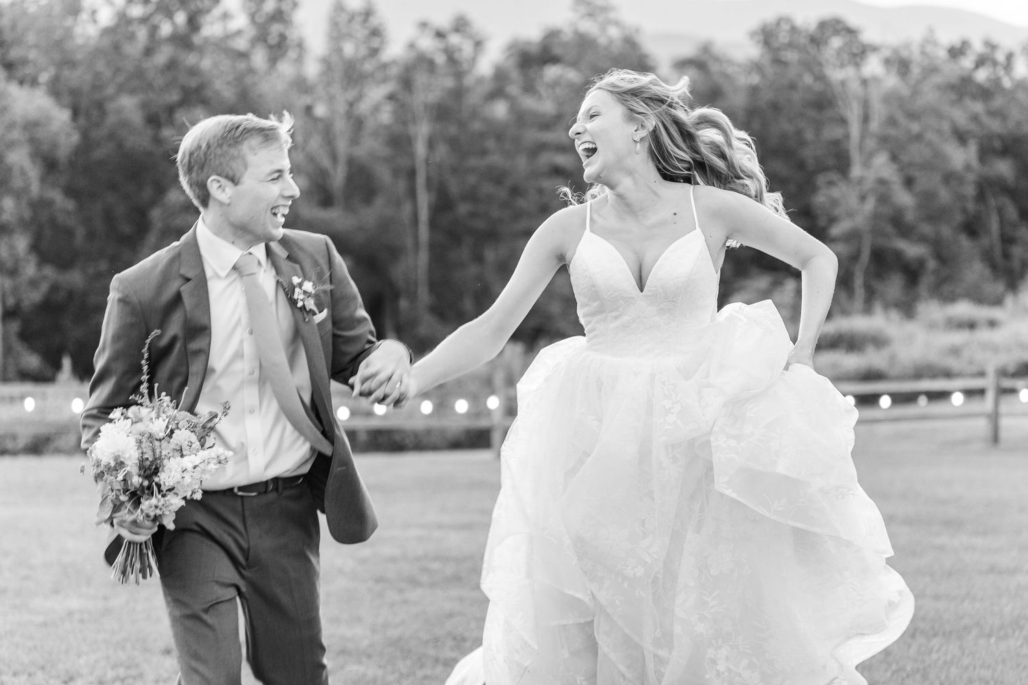 Wedding party members pose and laugh together outdoors in natural lighting  at Appalachian View Venue with Boone Wedding Photographer