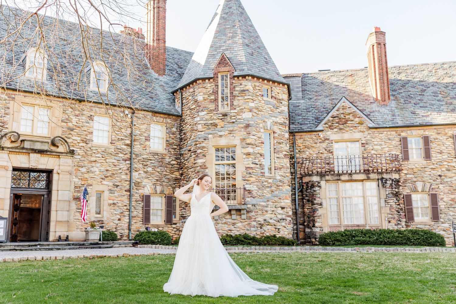 Wedding dress silhouette against historic stone building exterior at the Graylyn Estate with Winston Salem Wedding photographer