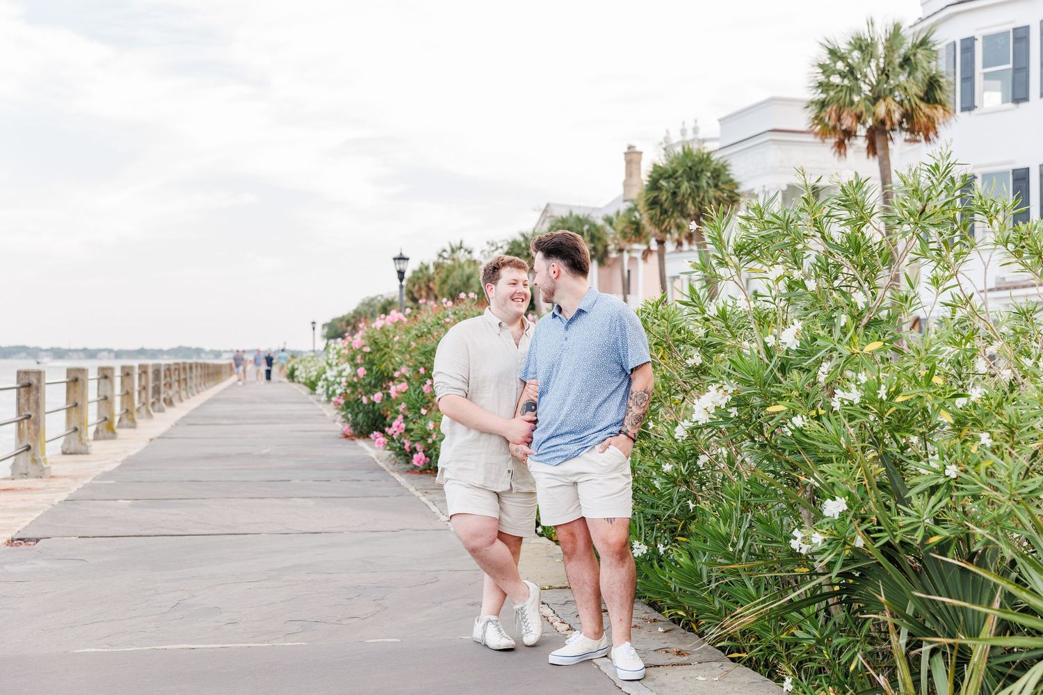 Scenic Charleston street photography with palm trees and historic architecture with Charleston Engagement Photographer at the River Walk