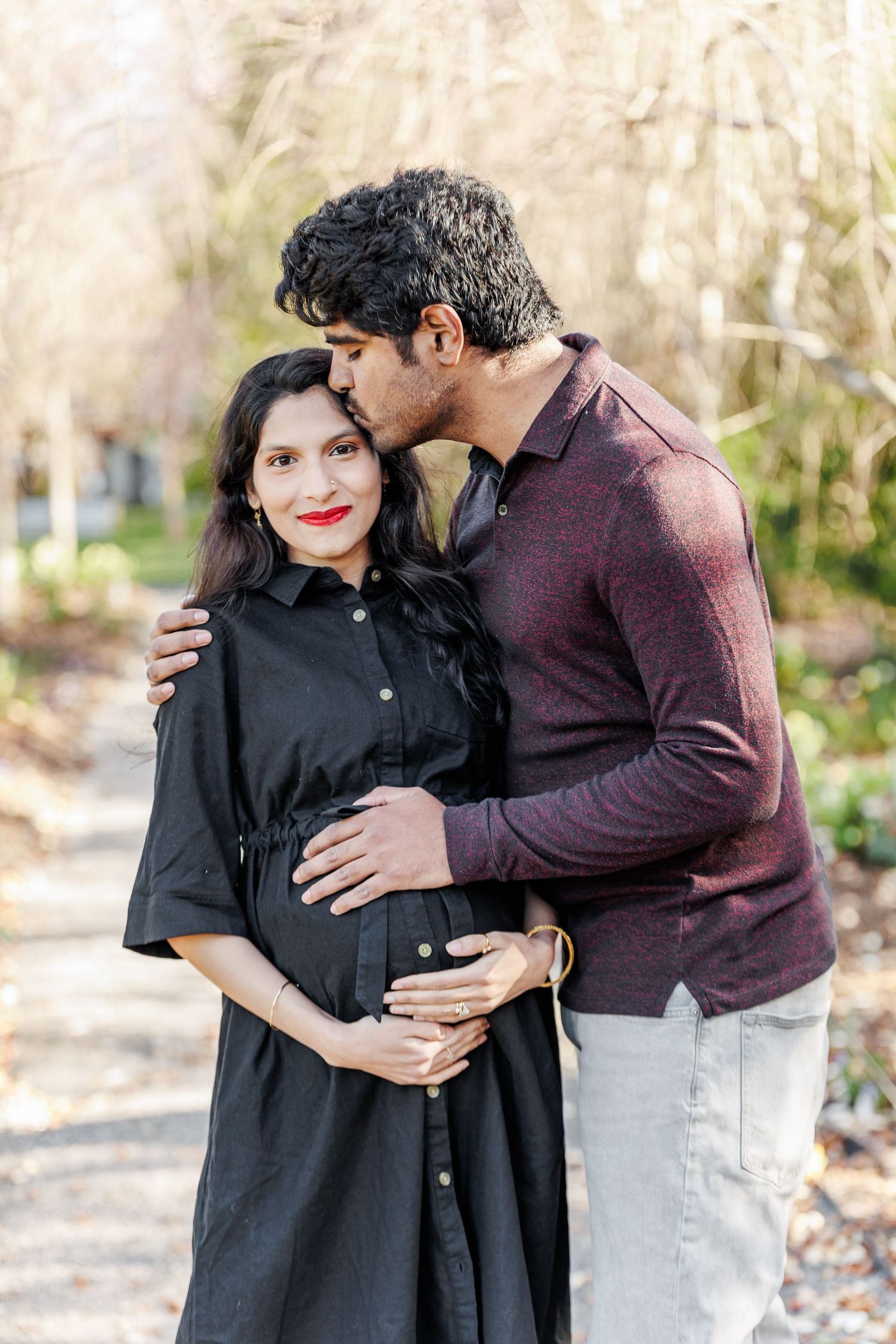 Couple shares tender moments during outdoor maternity photo session in Winston Salem  NC  with a Maternity Photographer