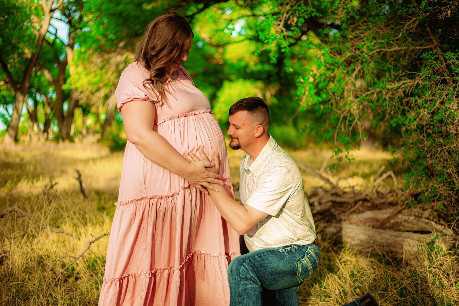 Mom and dad maternity photoshoot at golden hour