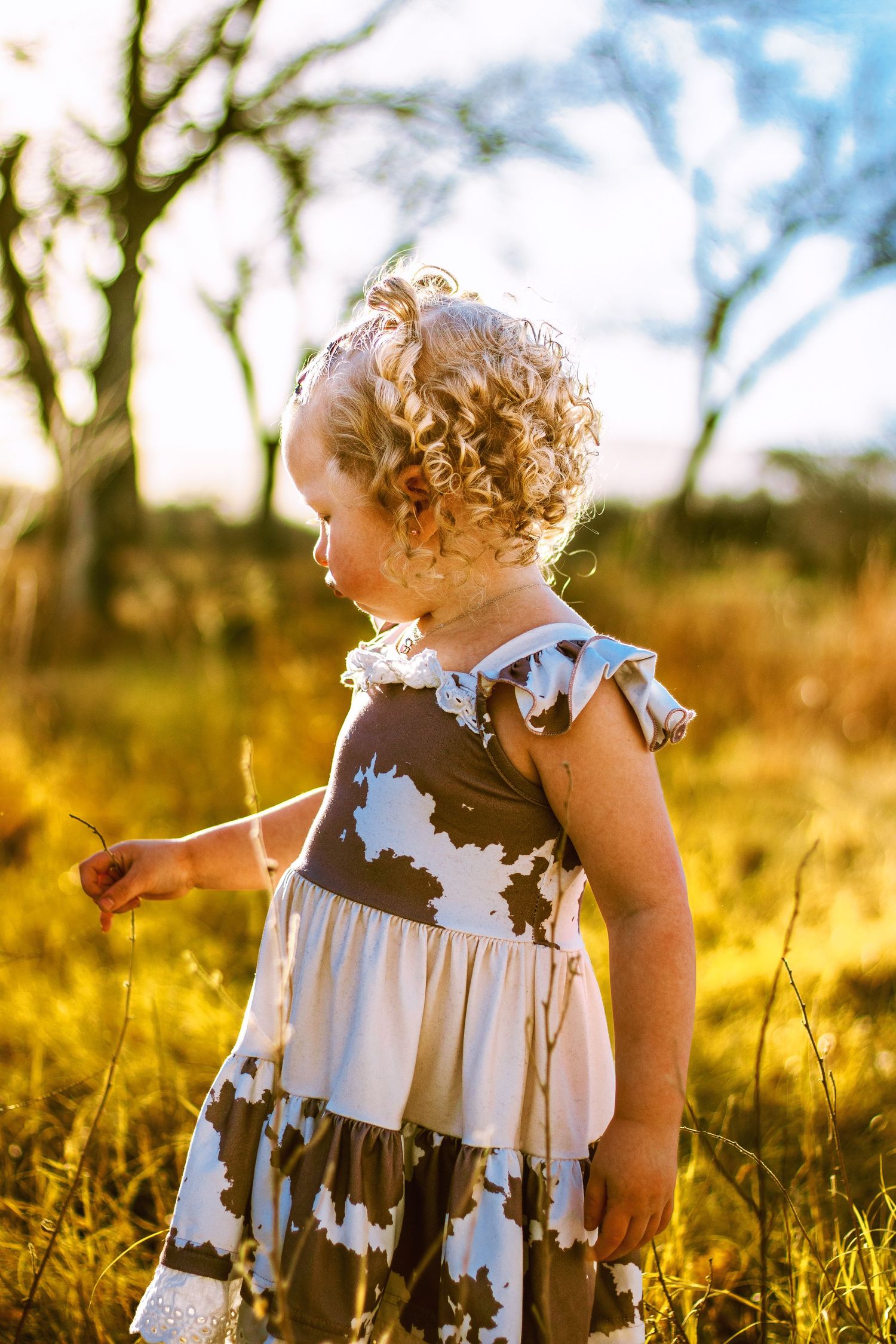Toddler running through field