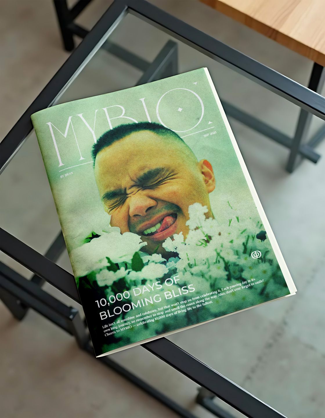 Magazine mockup of the front cover of Brandon's MYRIO editorial in which the magazine lays on a clear glass table.