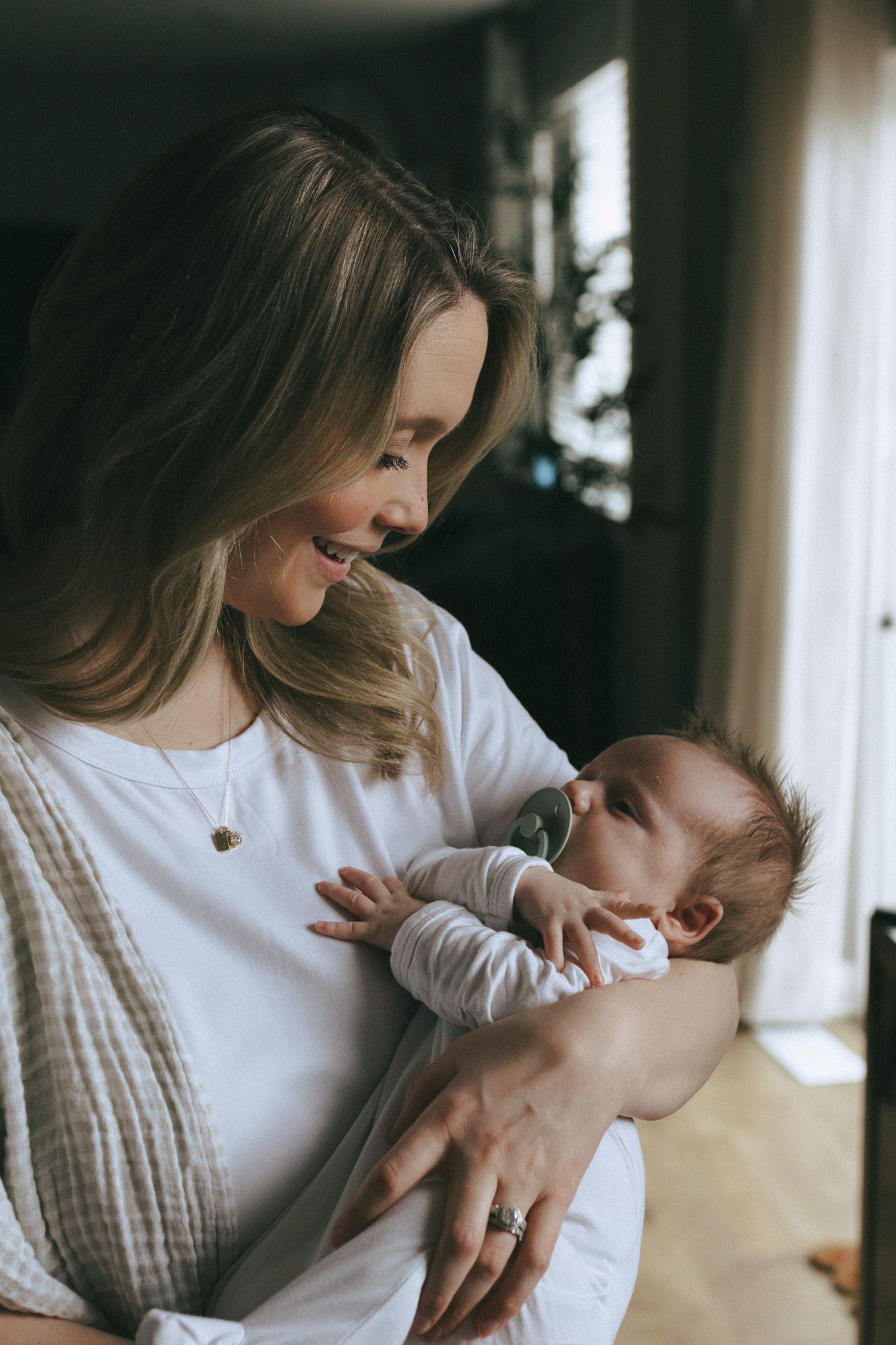 Mother holding her newborn baby boy.